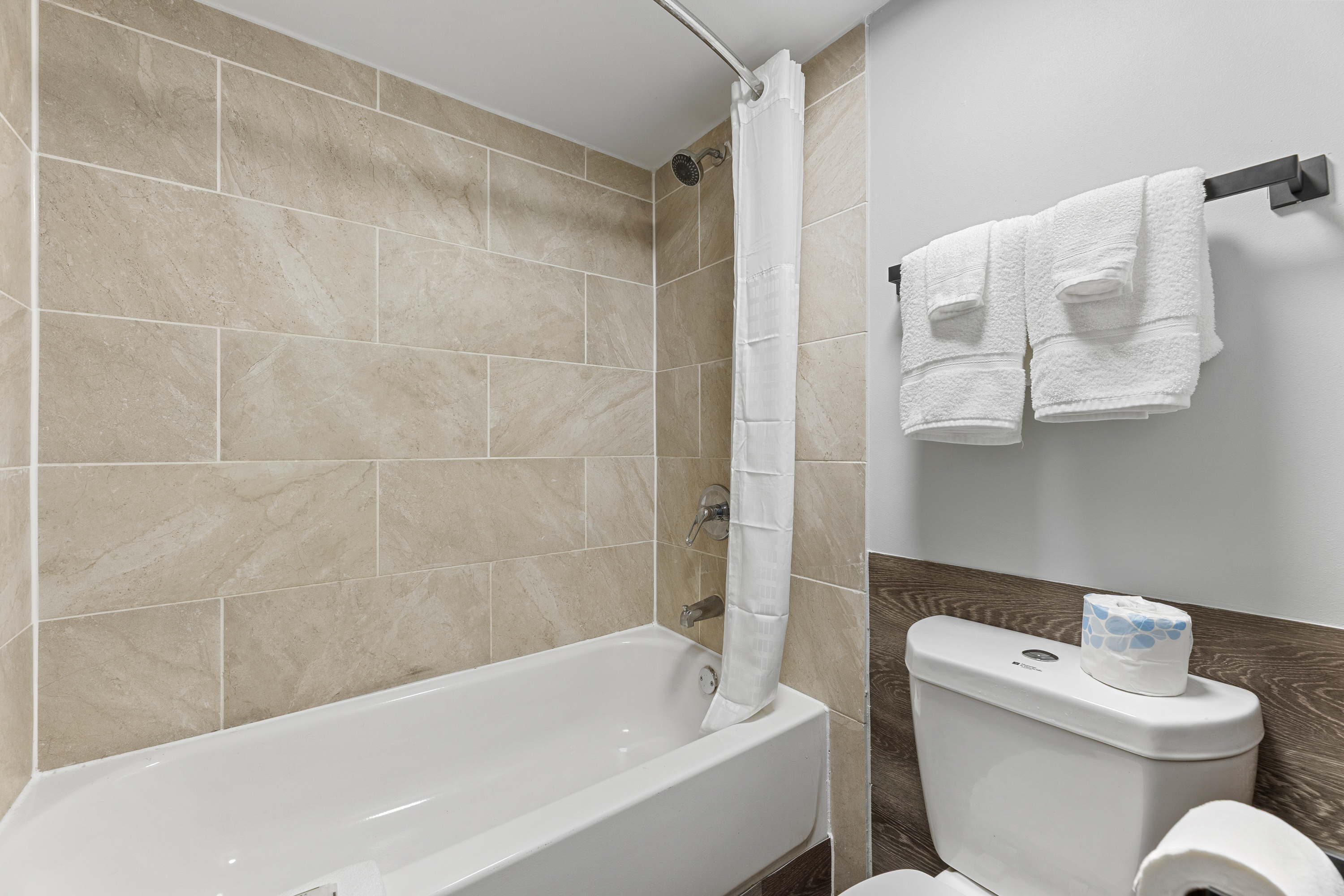 Guest room bath at the Days Inn & Suites by Wyndham Texas City/Galveston Area in Texas City, Texas