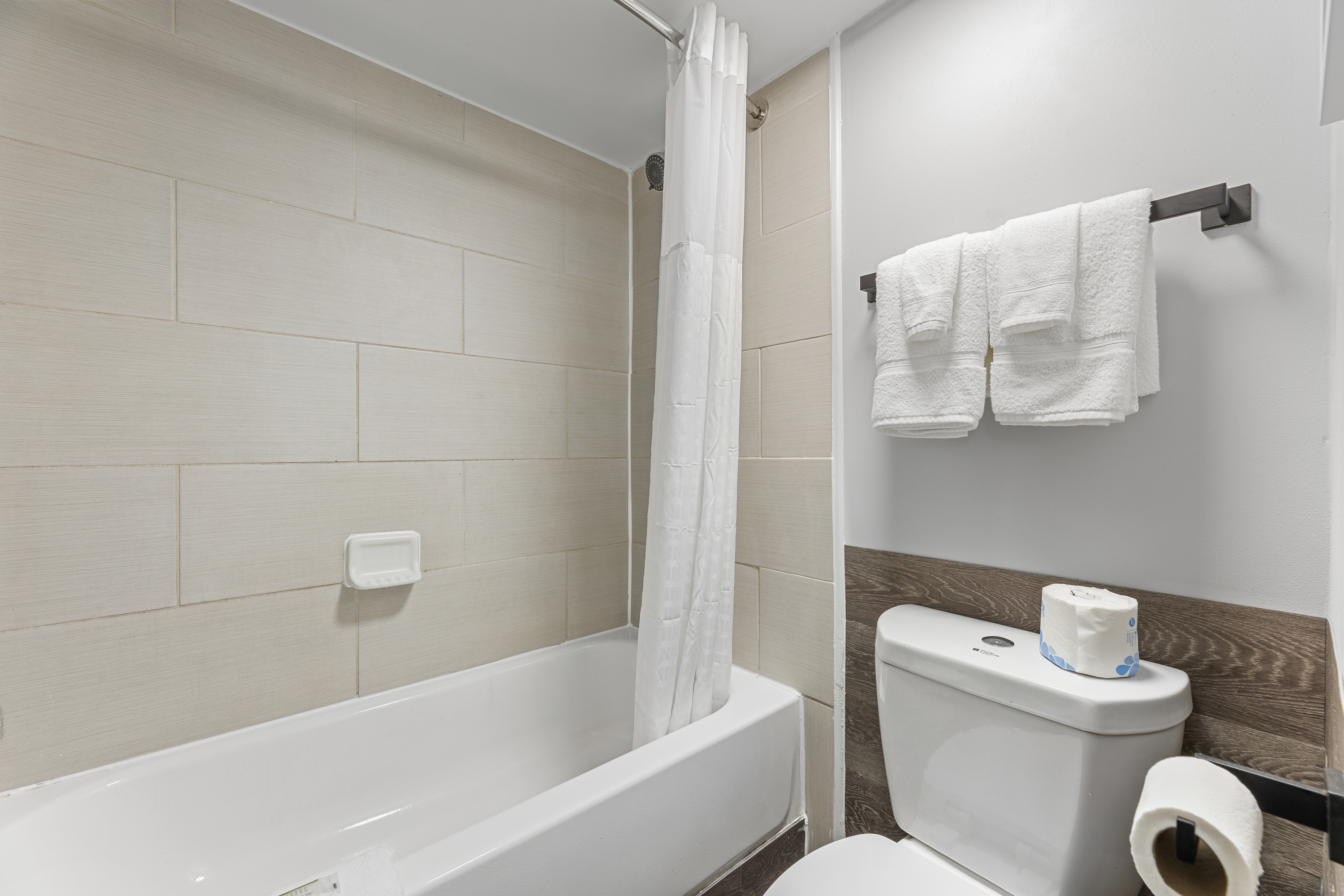 Guest room bath at the Days Inn & Suites by Wyndham Texas City/Galveston Area in Texas City, Texas