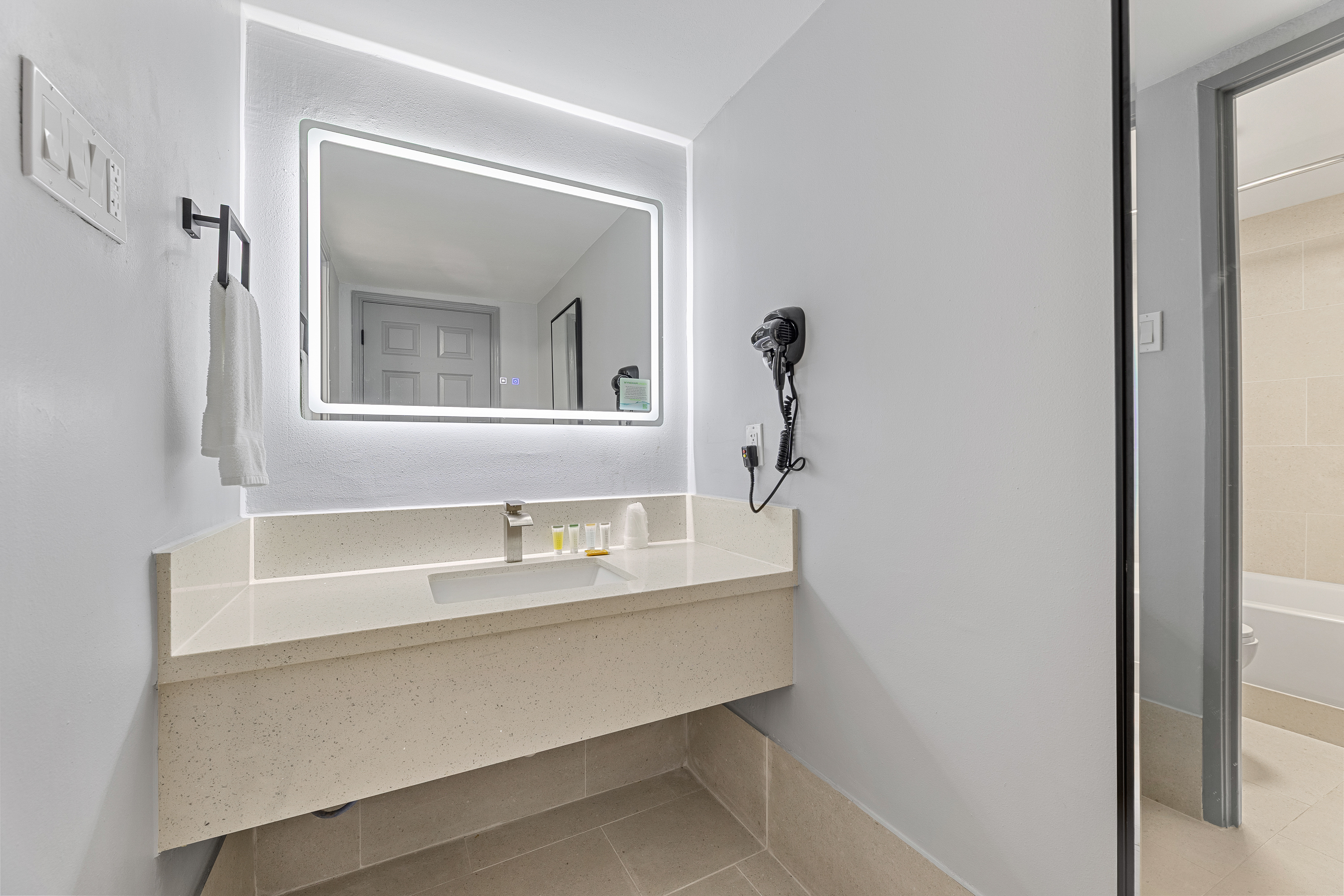 Guest room bath at the Days Inn & Suites by Wyndham Texas City/Galveston Area in Texas City, Texas