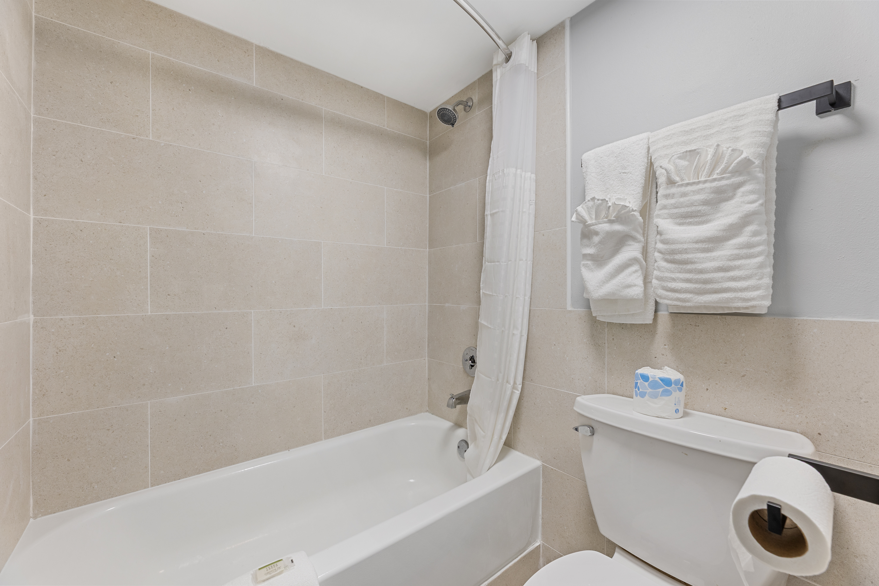 Guest room bath at the Days Inn & Suites by Wyndham Texas City/Galveston Area in Texas City, Texas