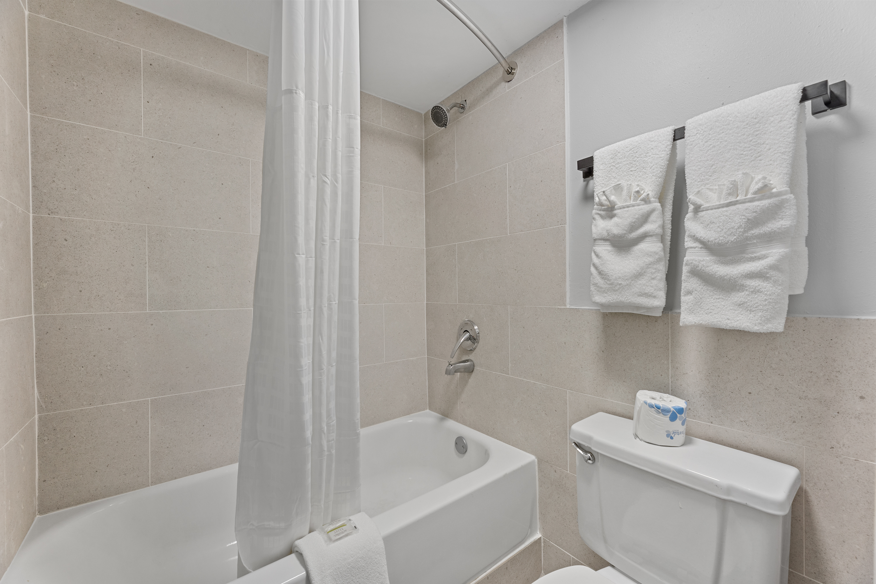 Guest room bath at the Days Inn & Suites by Wyndham Texas City/Galveston Area in Texas City, Texas