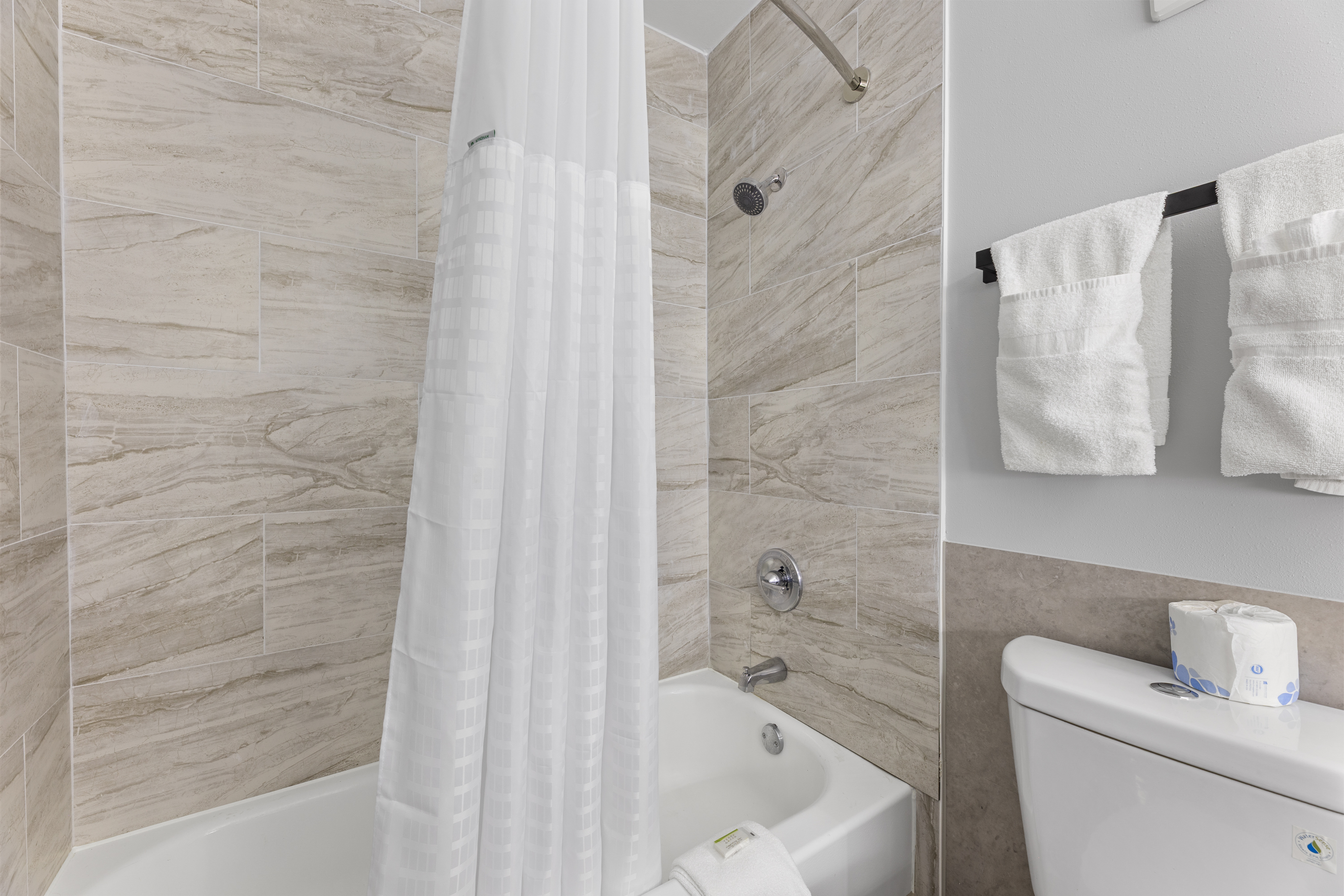 Guest room bath at the Days Inn & Suites by Wyndham Texas City in Texas City, Texas