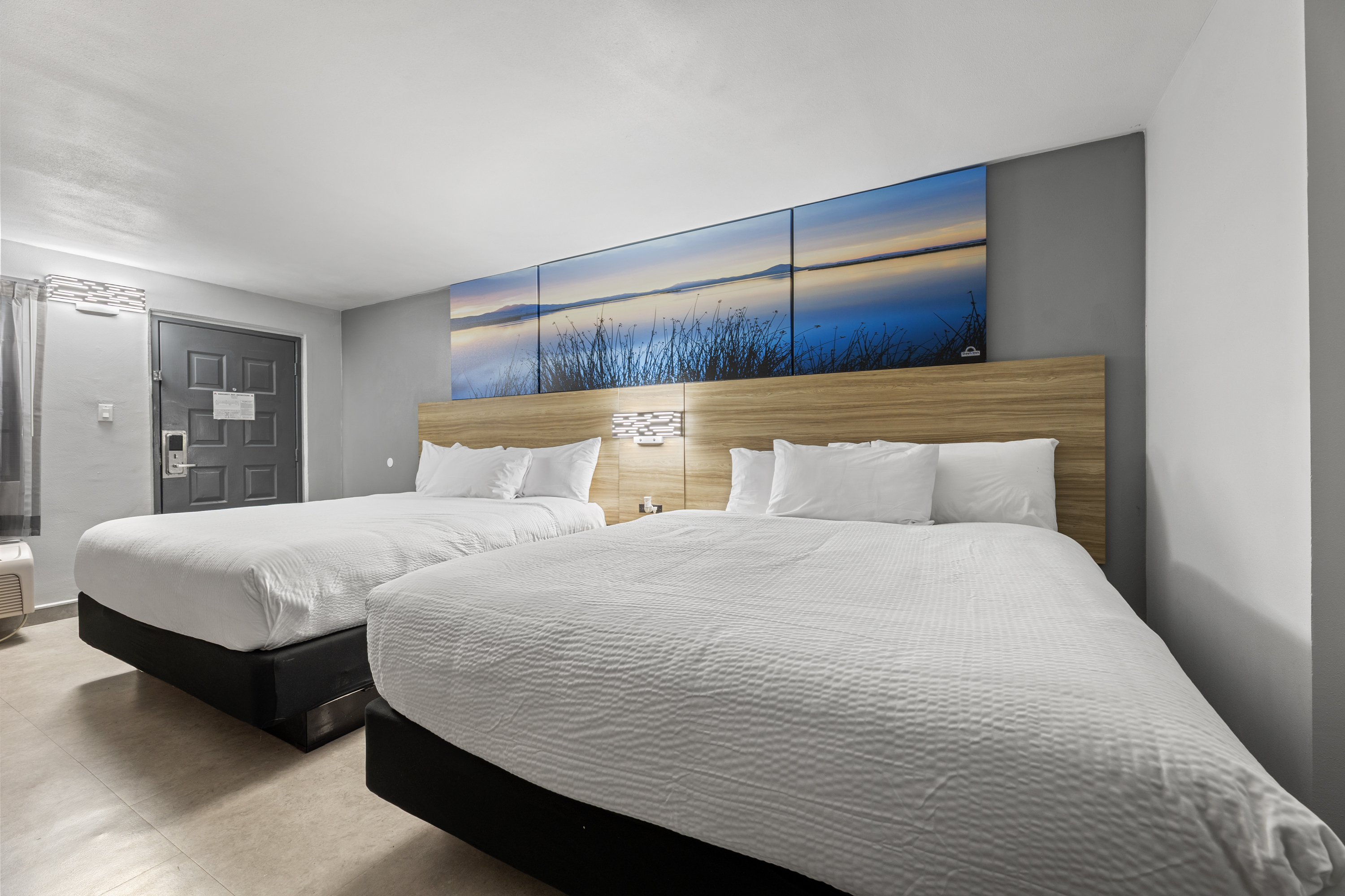 Guest room at the Days Inn & Suites by Wyndham Texas City/Galveston Area in Texas City, Texas