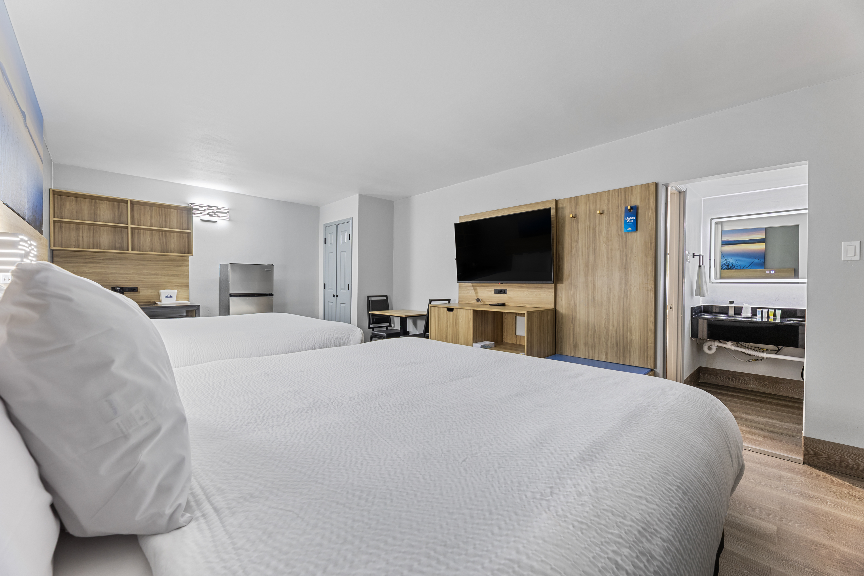 Guest room at the Days Inn & Suites by Wyndham Texas City in Texas City, Texas