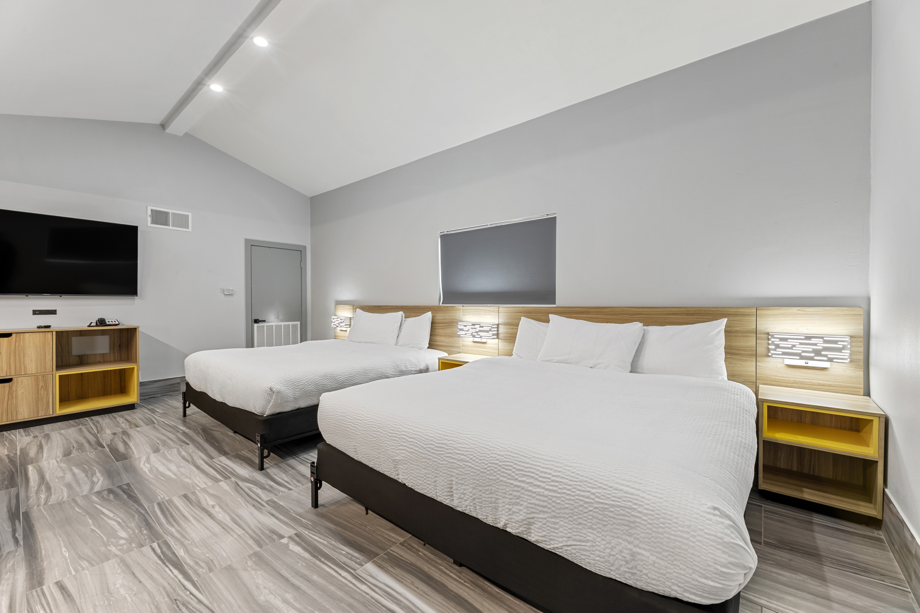 Guest room at the Days Inn & Suites by Wyndham Texas City in Texas City, Texas