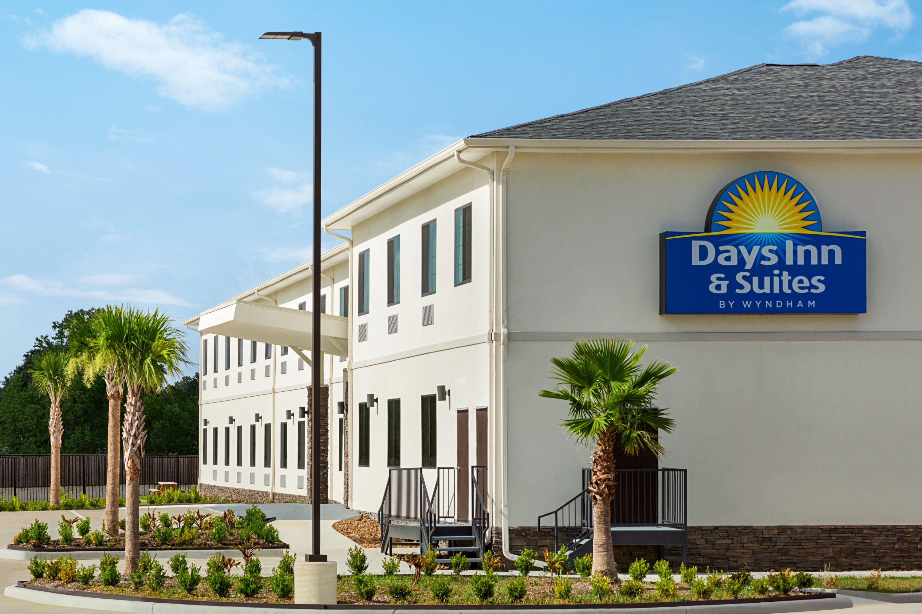 Exterior of Days Inn & Suites by Wyndham Greater Tomball hotel in Tomball, Texas