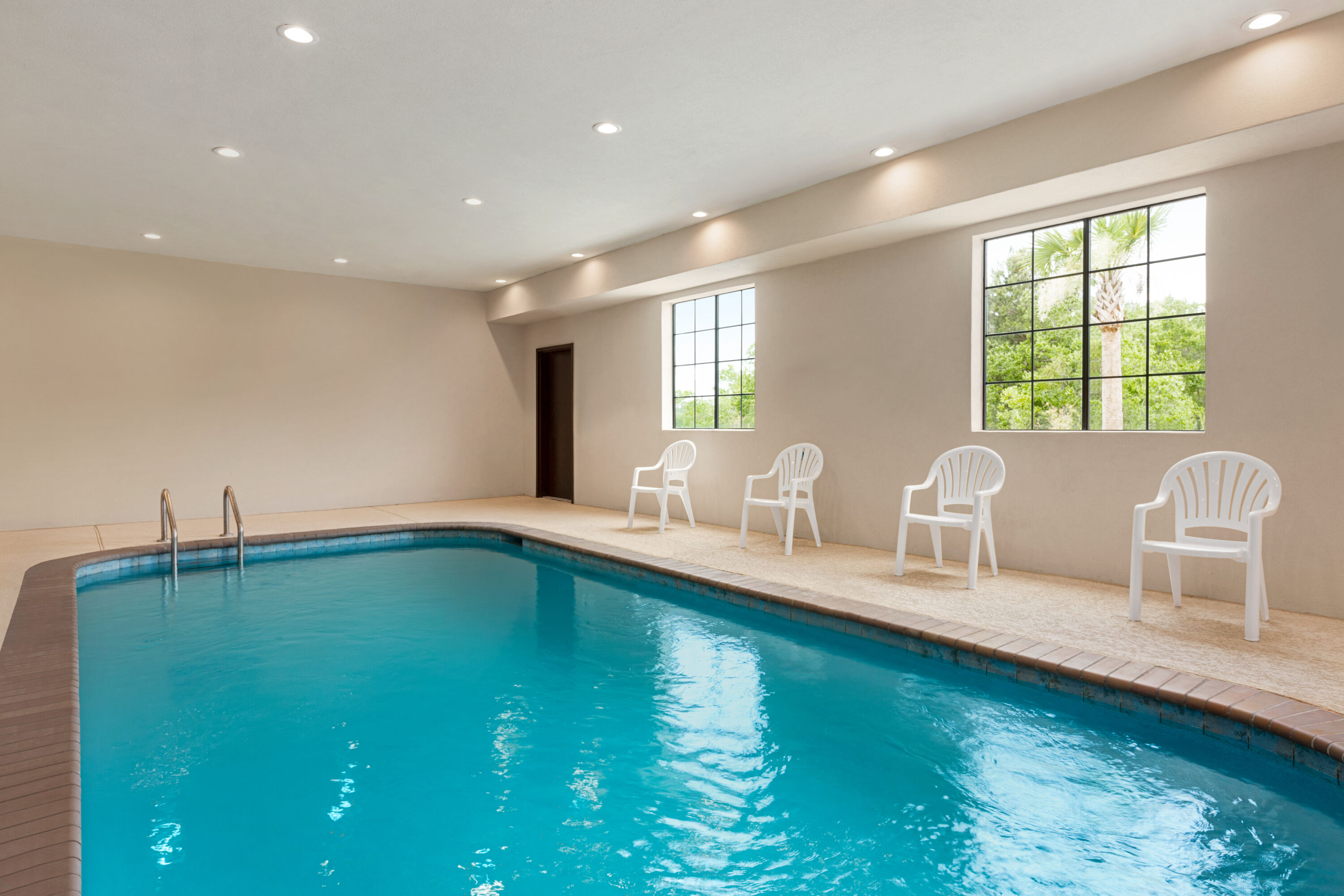 Indoor pool at the Days Inn & Suites by Wyndham Greater Tomball in Tomball, Texas
