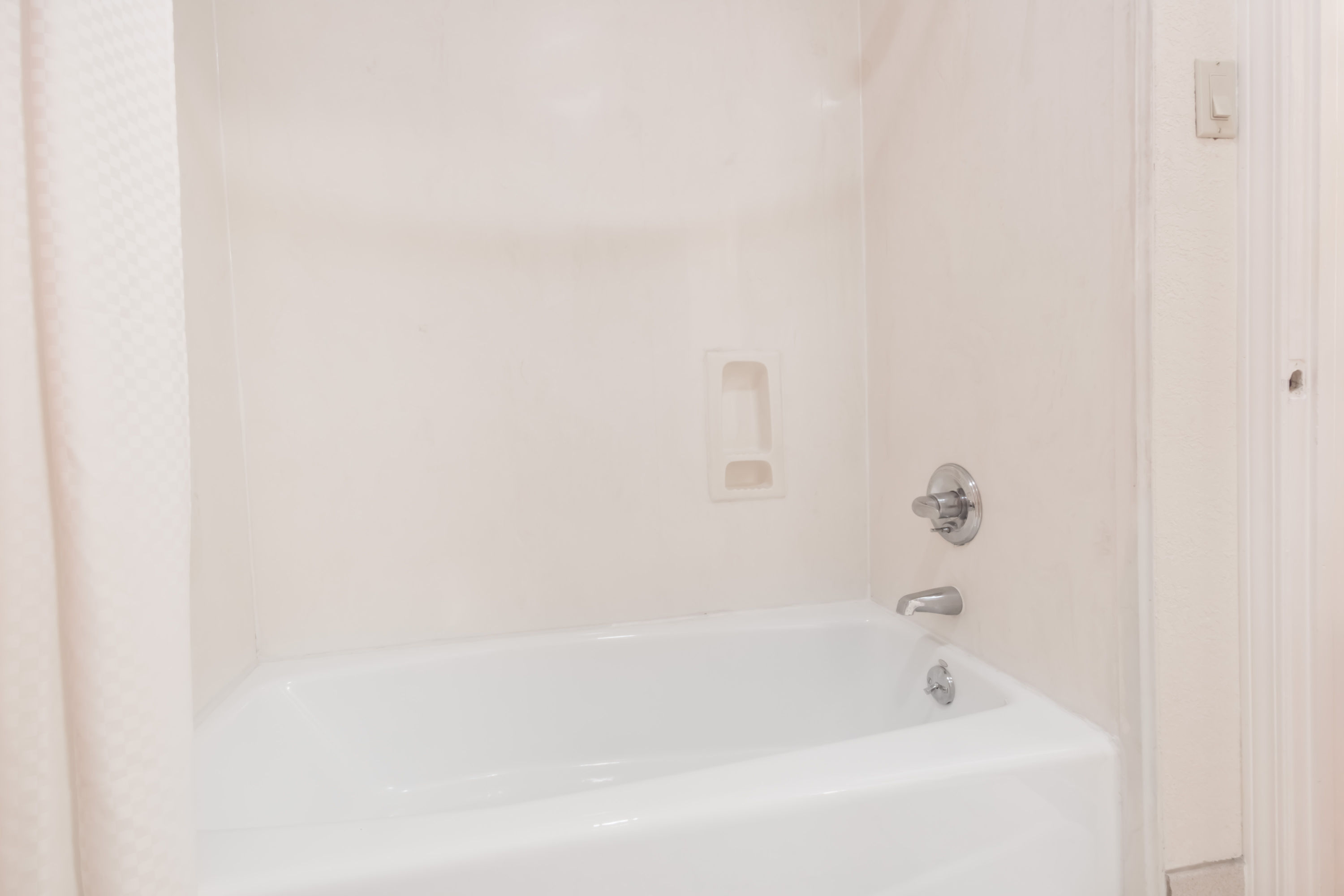 Guest room at the Days Inn & Suites by Wyndham Winnie in Winnie, Texas