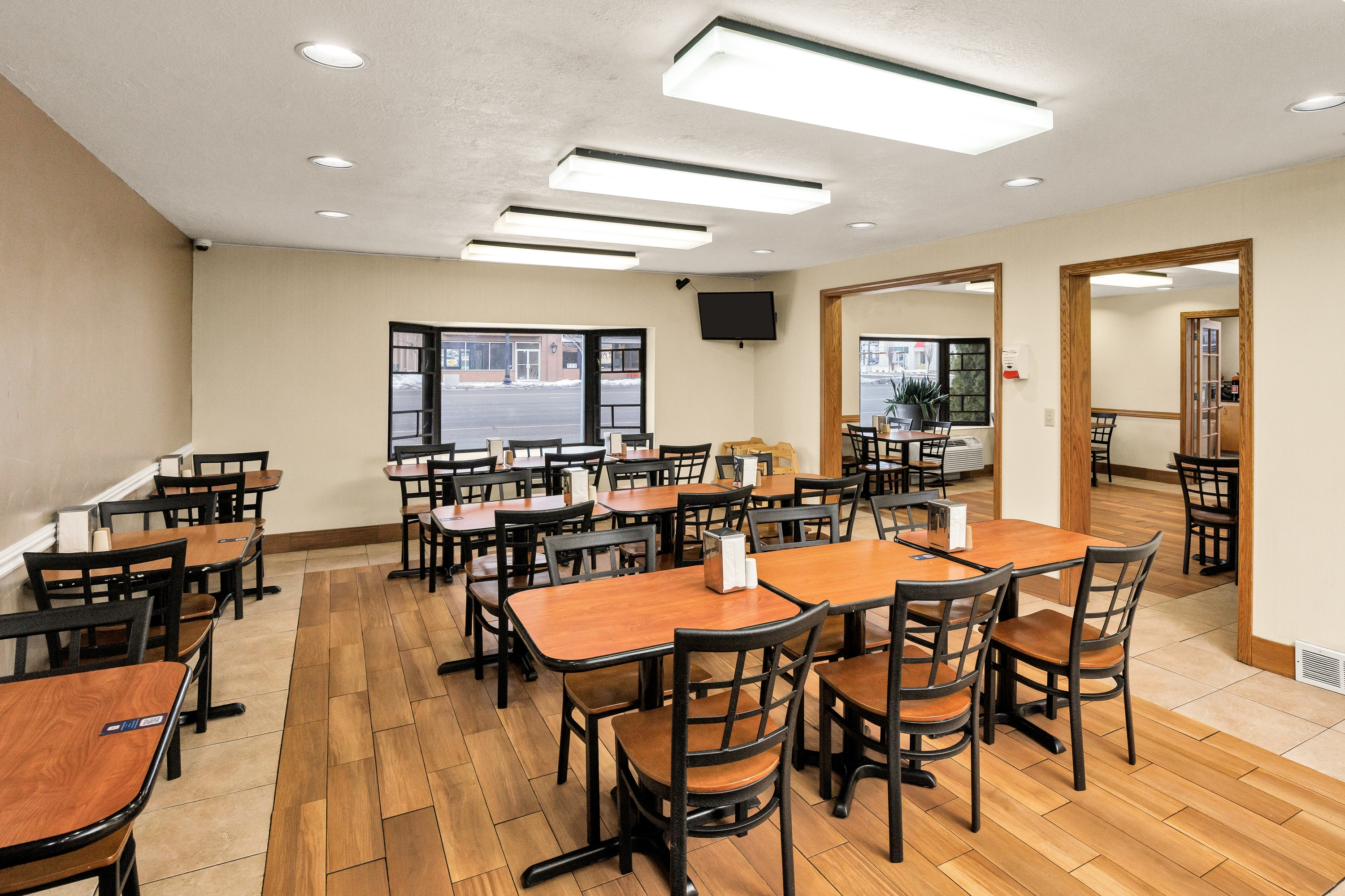 Days Inn & Suites by Wyndham Logan restaurant breakfast area with seating in Logan, Utah