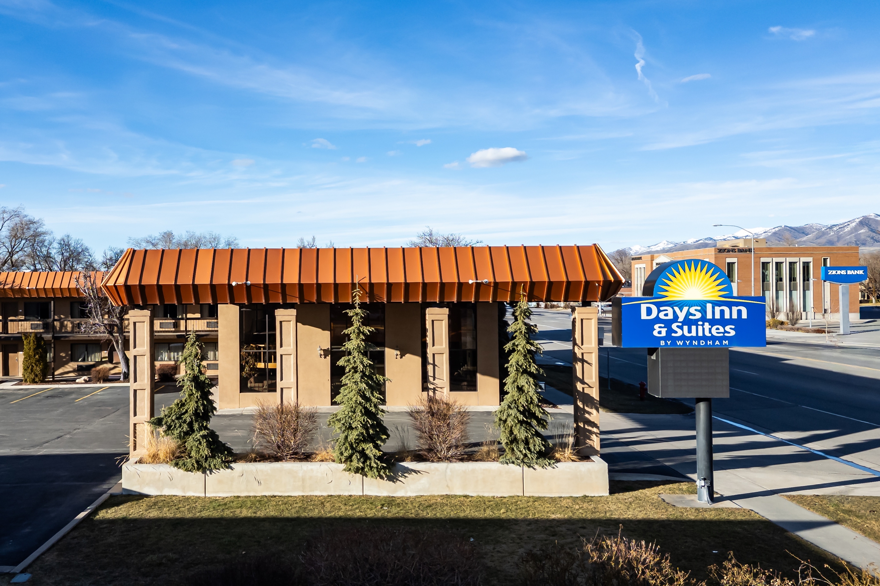 Exterior of Days Inn & Suites by Wyndham Logan hotel in Logan, Utah