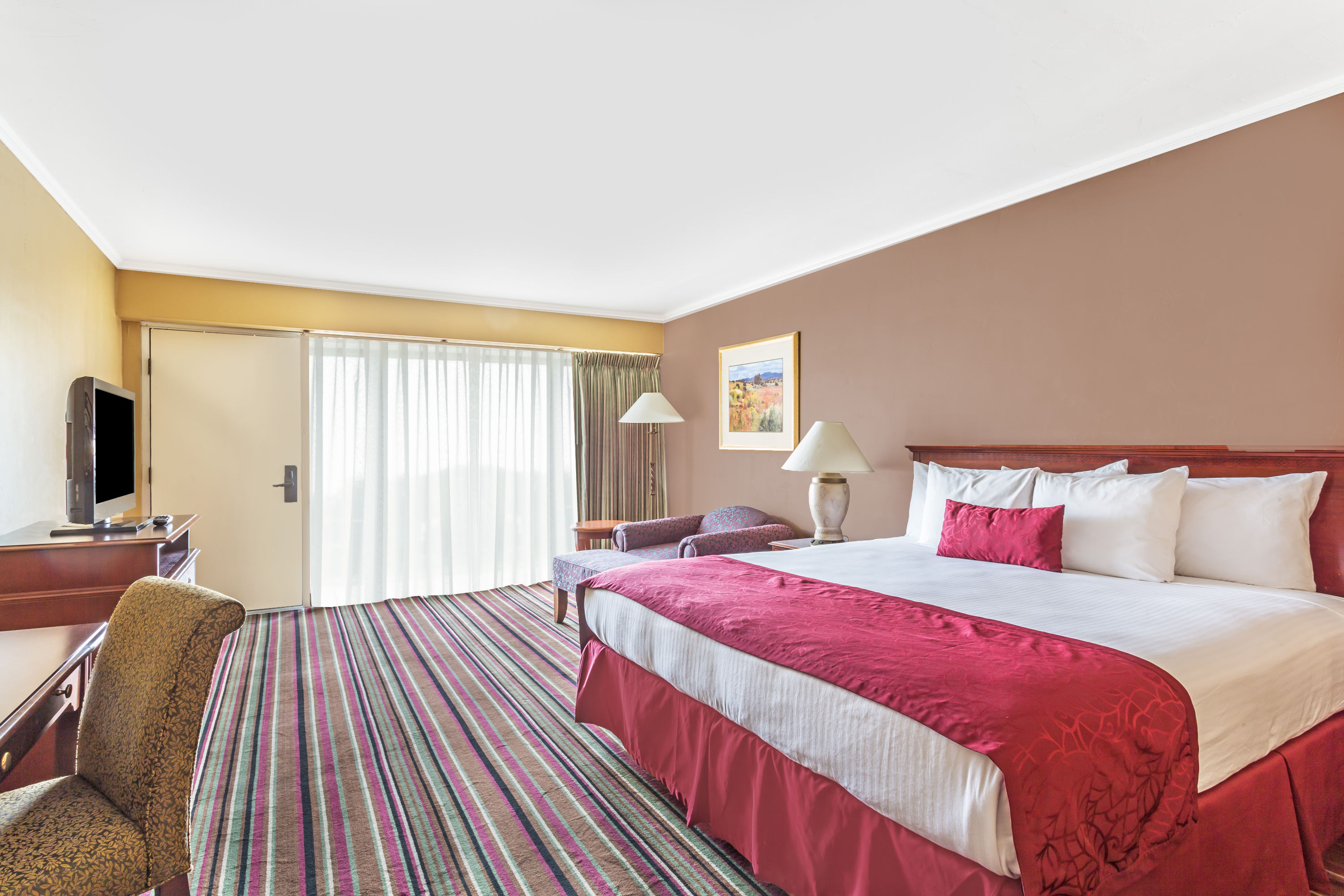 Guest room at the Days Inn & Suites by Wyndham Logan in Logan, Utah