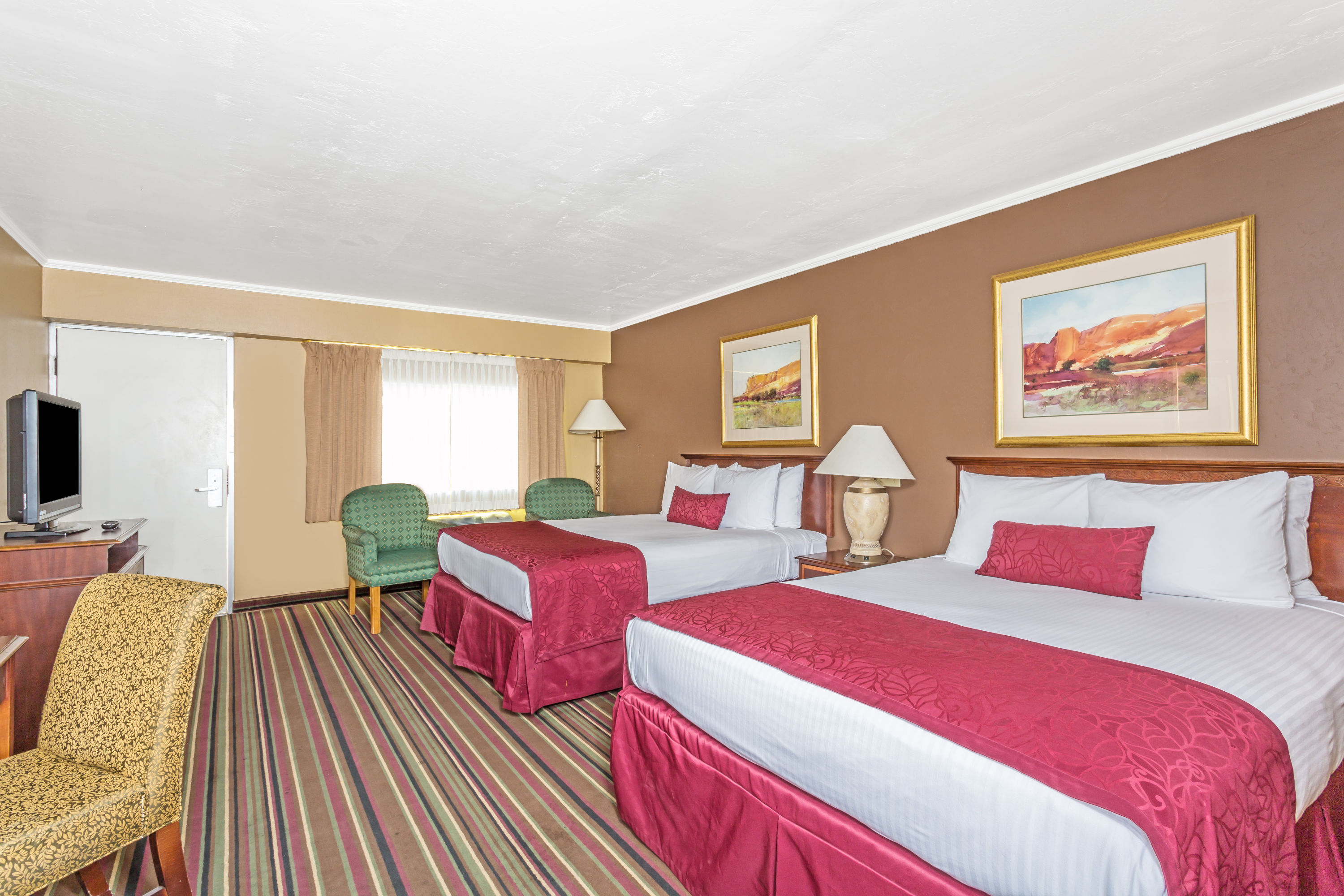 Guest room at the Days Inn & Suites by Wyndham Logan in Logan, Utah