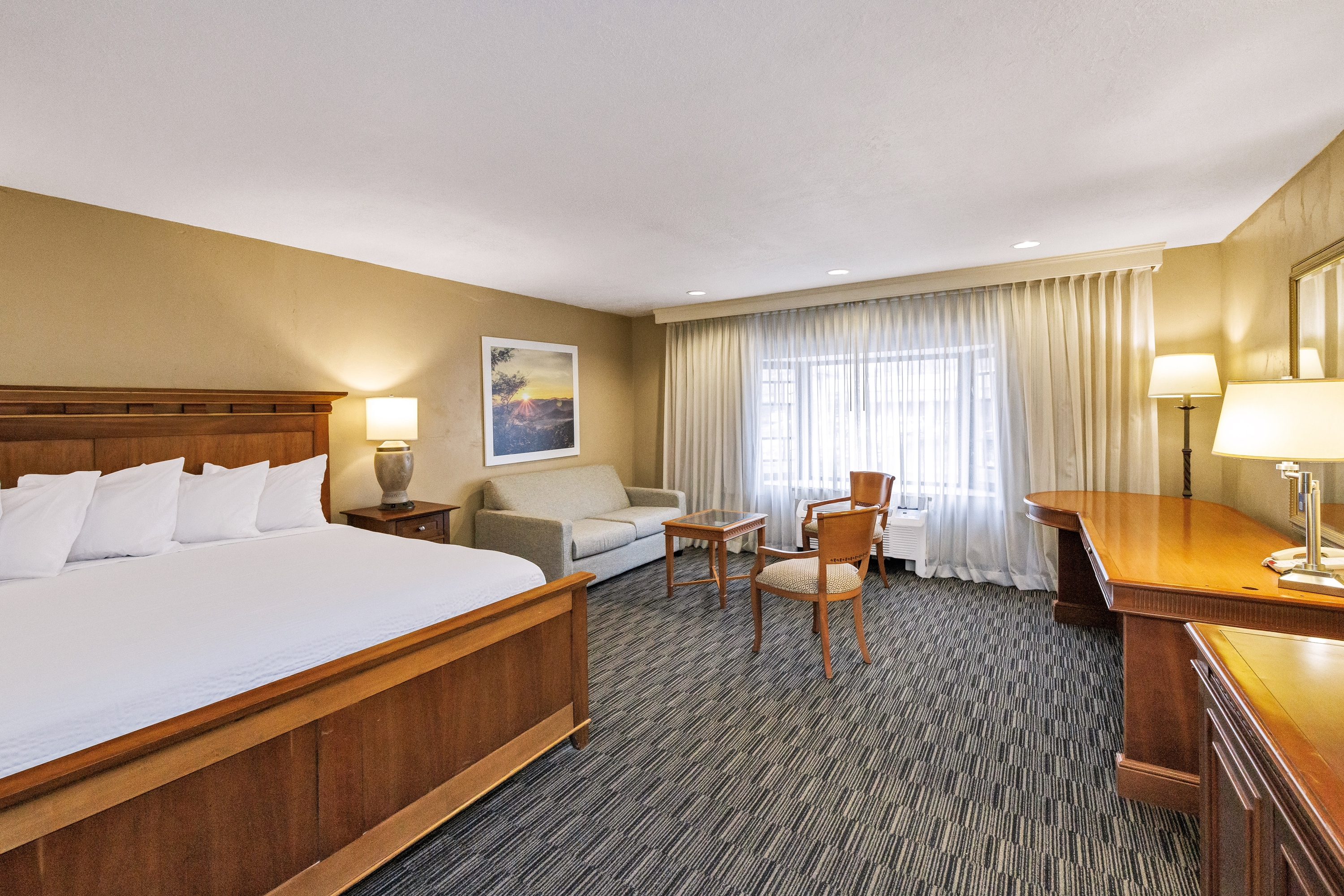 Guest room at the Days Inn & Suites by Wyndham Logan in Logan, Utah