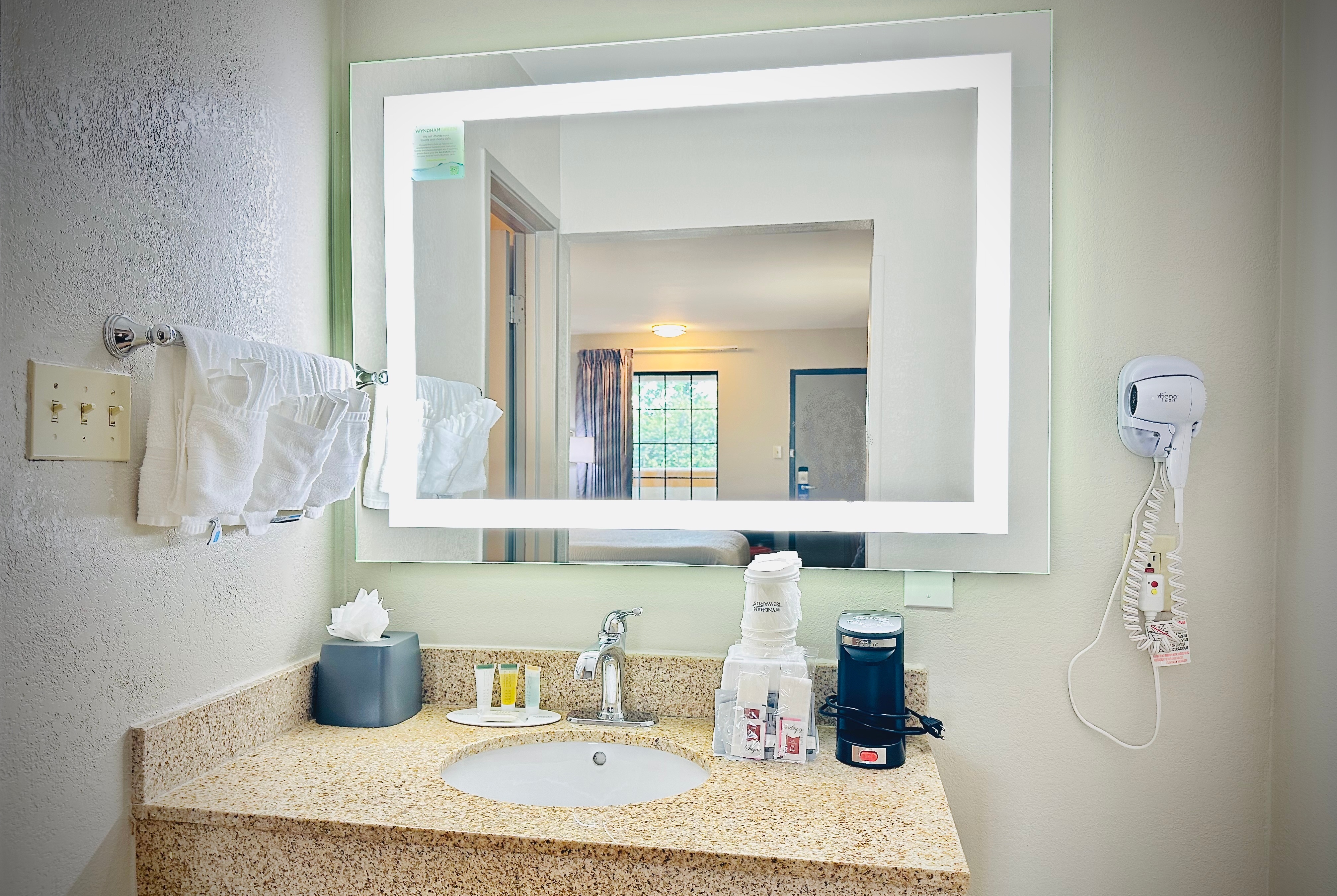 Guest room bath at the Days Inn by Wyndham Alexandria in Alexandria, Virginia