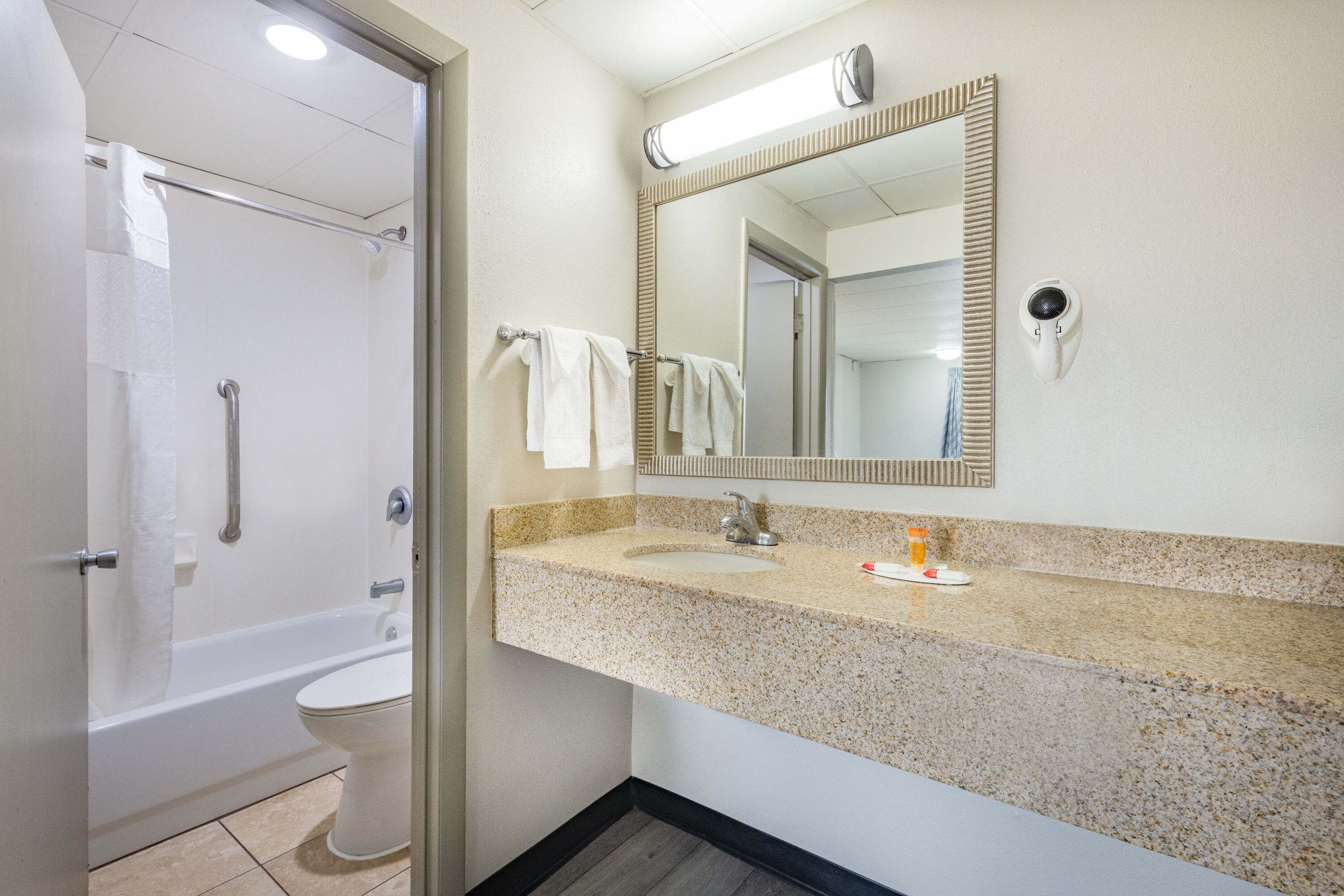 Guest room bath at the Days Inn by Wyndham Fredericksburg North in Fredericksburg, Virginia