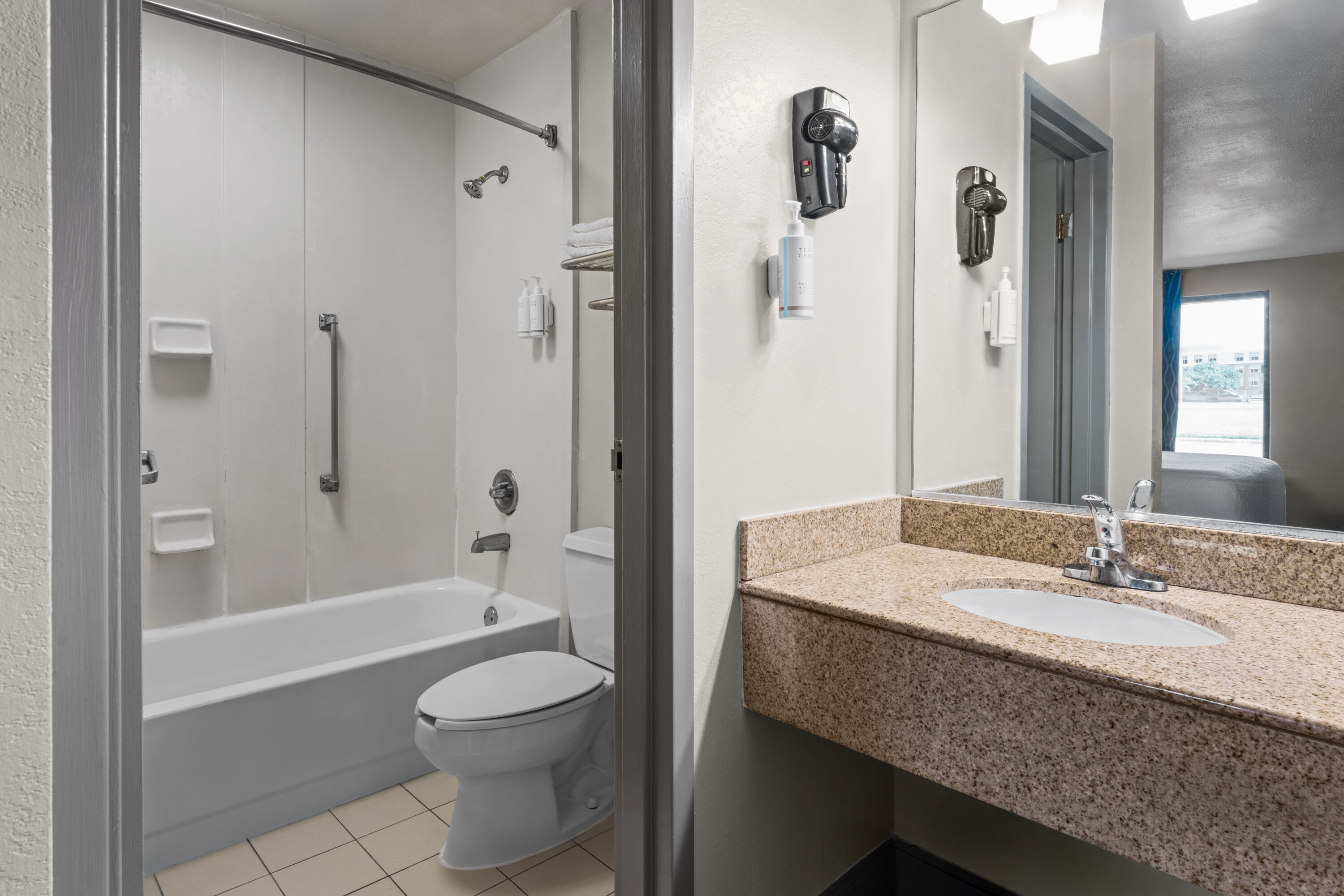 Guest room bath at the Days Inn by Wyndham Norfolk Airport in Norfolk, Virginia