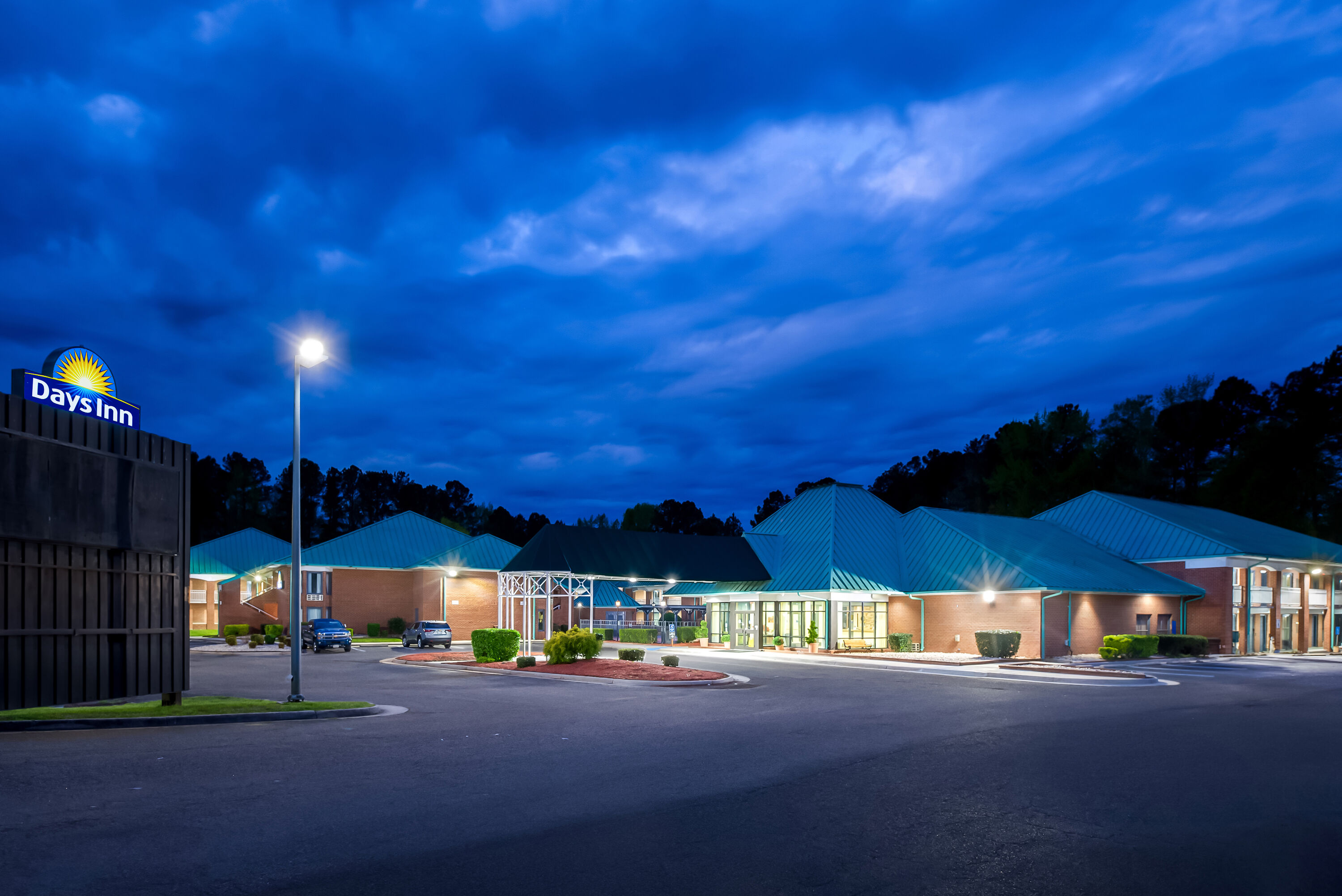 Exterior Night Image of Days Inn by Wyndham Petersburg/South Fort Lee hotel in Petersburg, Virginia