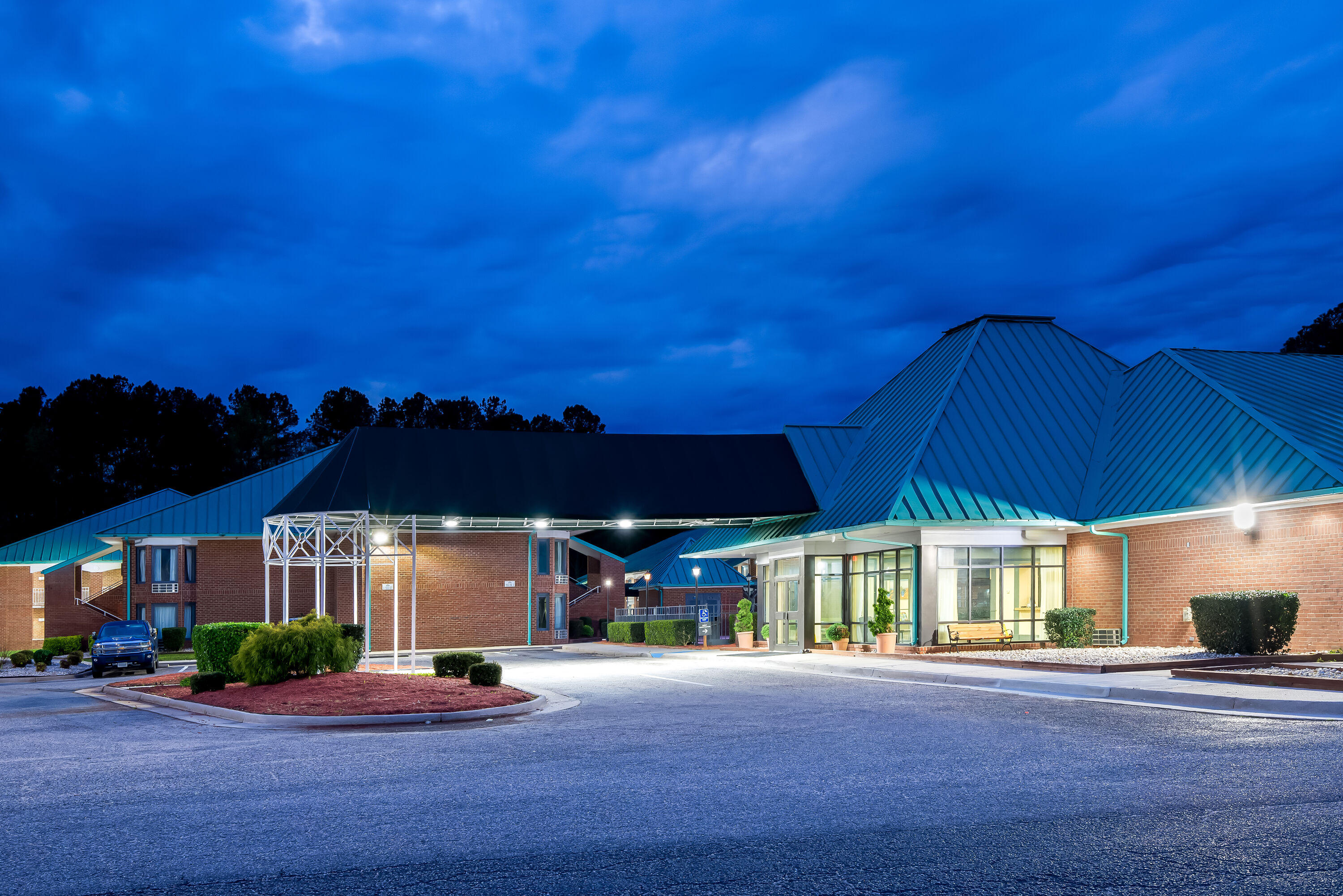 Exterior Night Image of Days Inn by Wyndham Petersburg/South Fort Lee hotel in Petersburg, Virginia