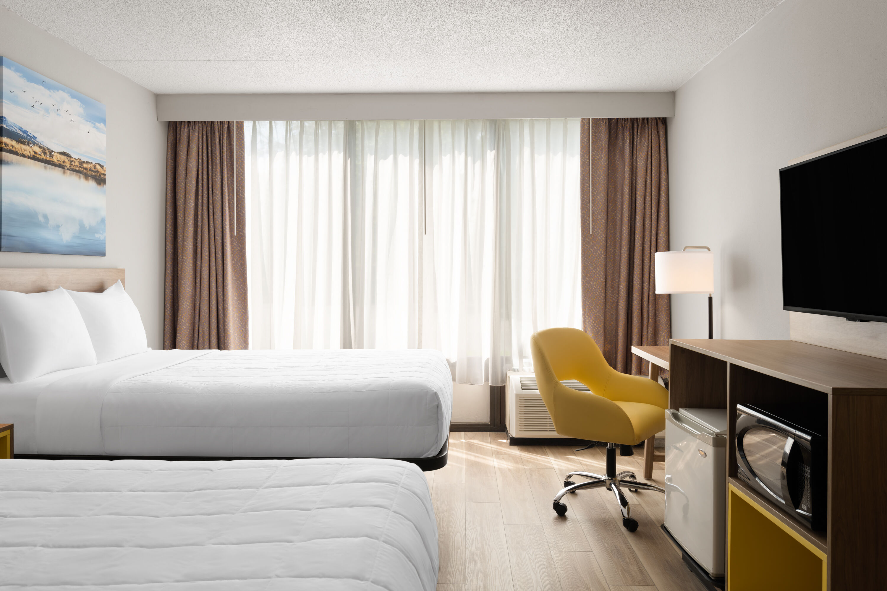 Guest room at the Days Hotel by Wyndham Williamsburg I-64 in Williamsburg, Virginia