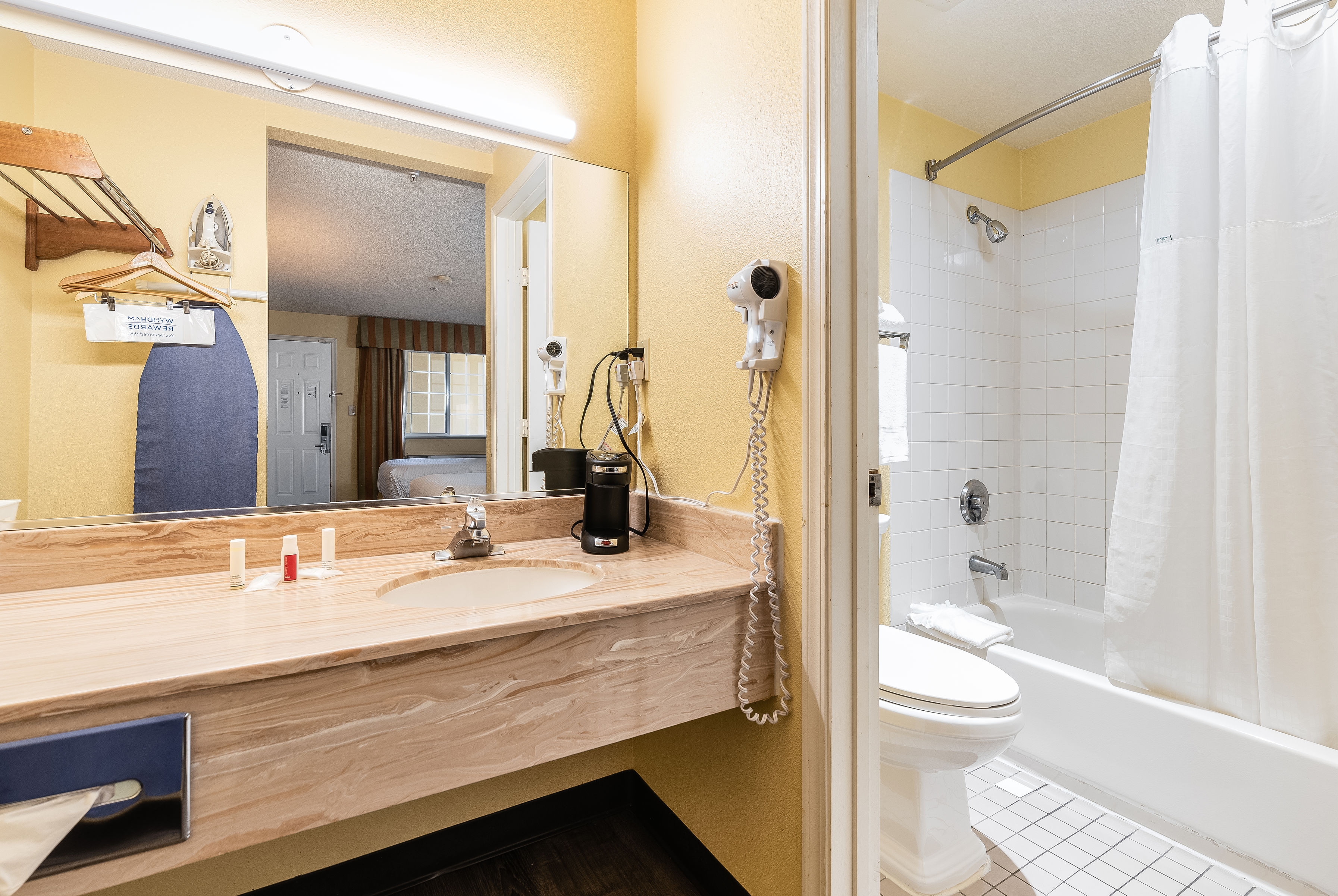 Guest room bath at the Days Inn by Wyndham Federal Way in Federal Way, Washington