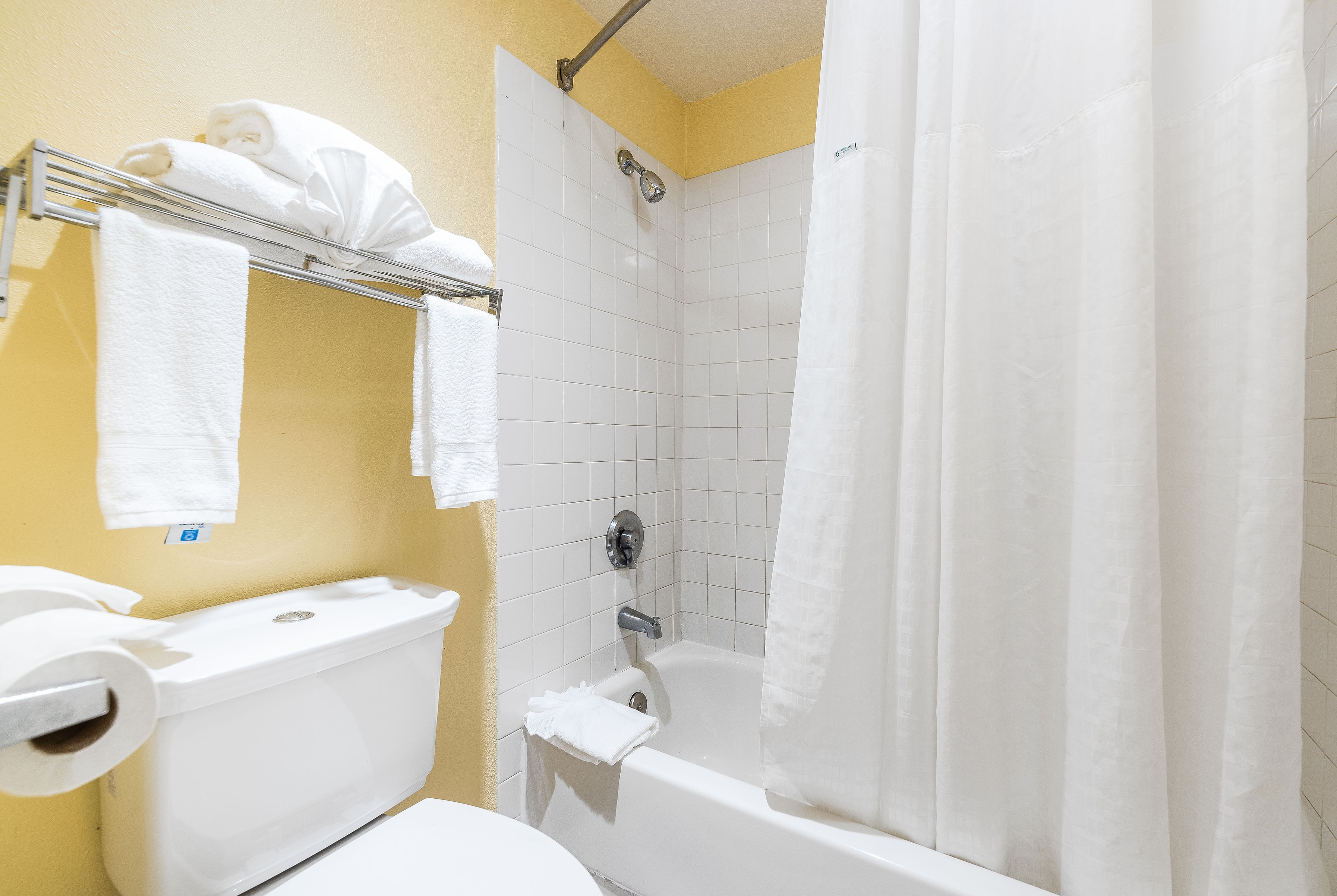 Guest room bath at the Days Inn by Wyndham Federal Way in Federal Way, Washington