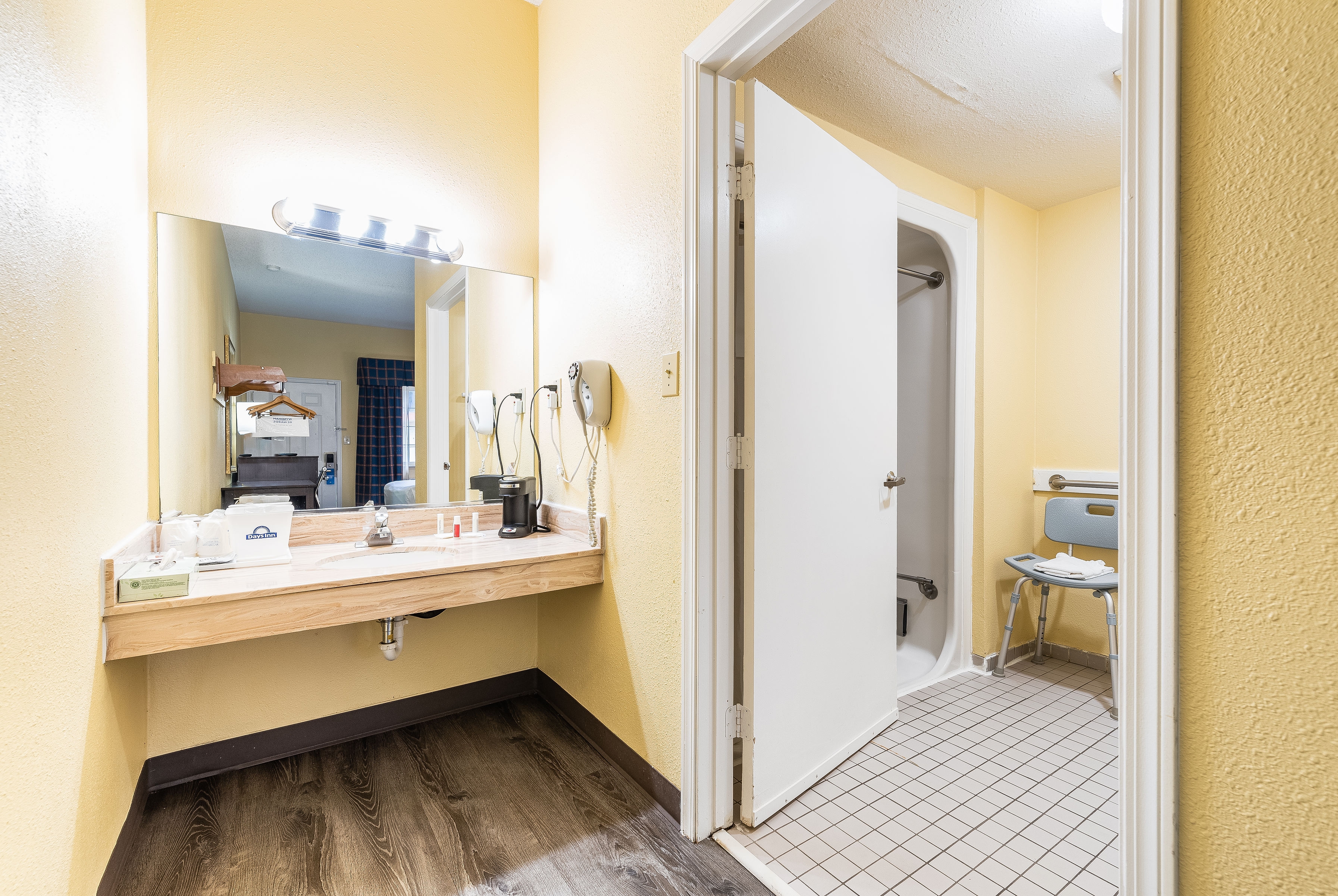 Guest room bath at the Days Inn by Wyndham Federal Way in Federal Way, Washington