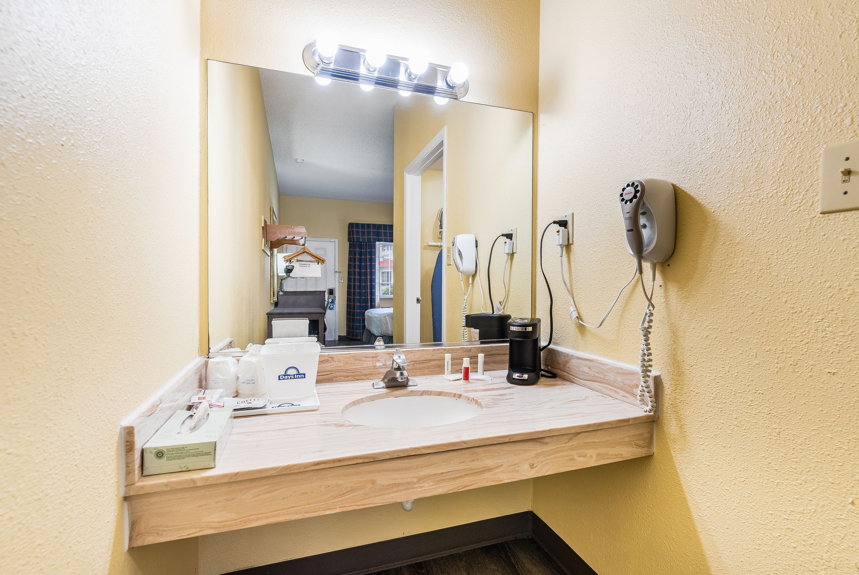 Guest room bath at the Days Inn by Wyndham Federal Way in Federal Way, Washington
