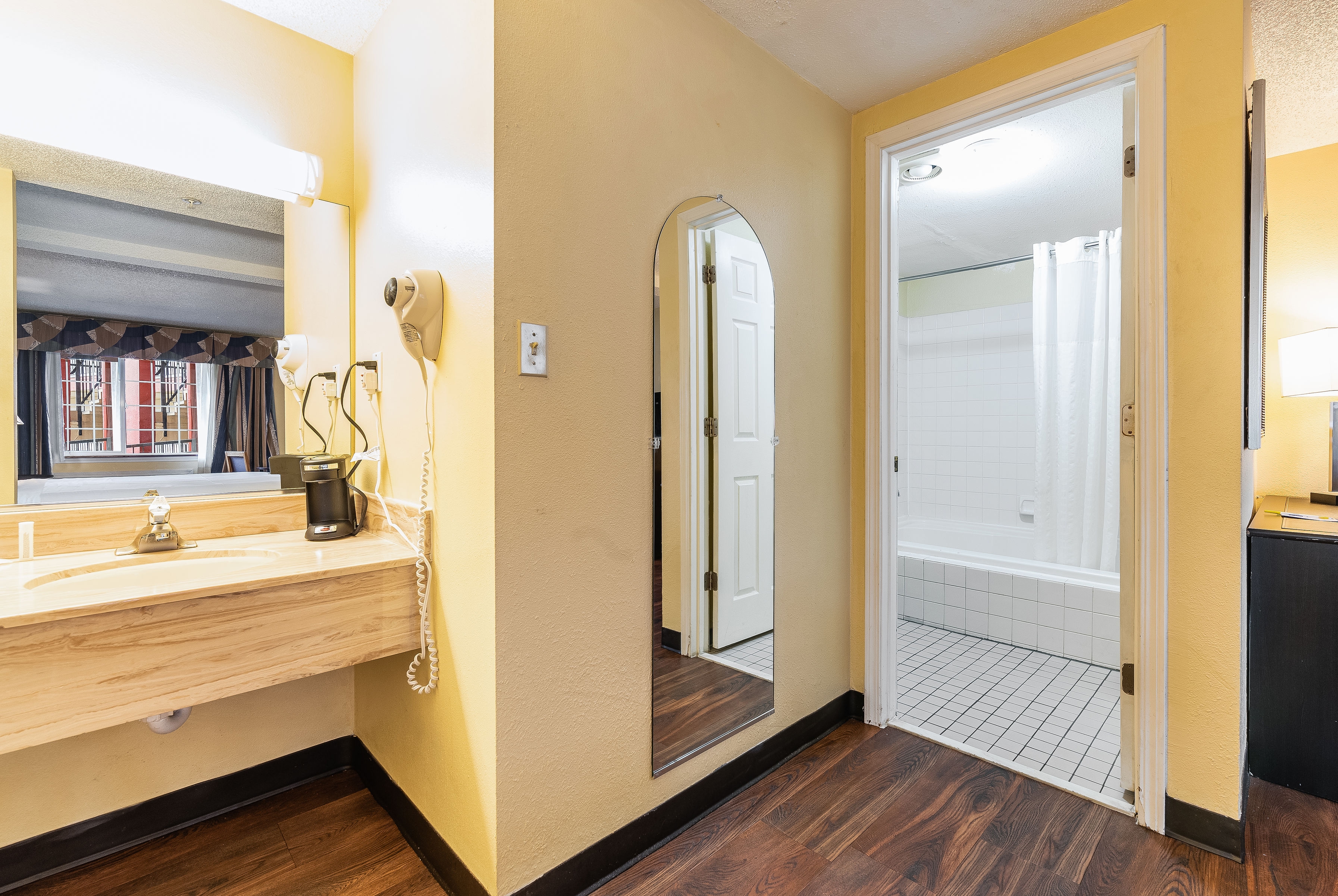Guest room bath at the Days Inn by Wyndham Federal Way in Federal Way, Washington