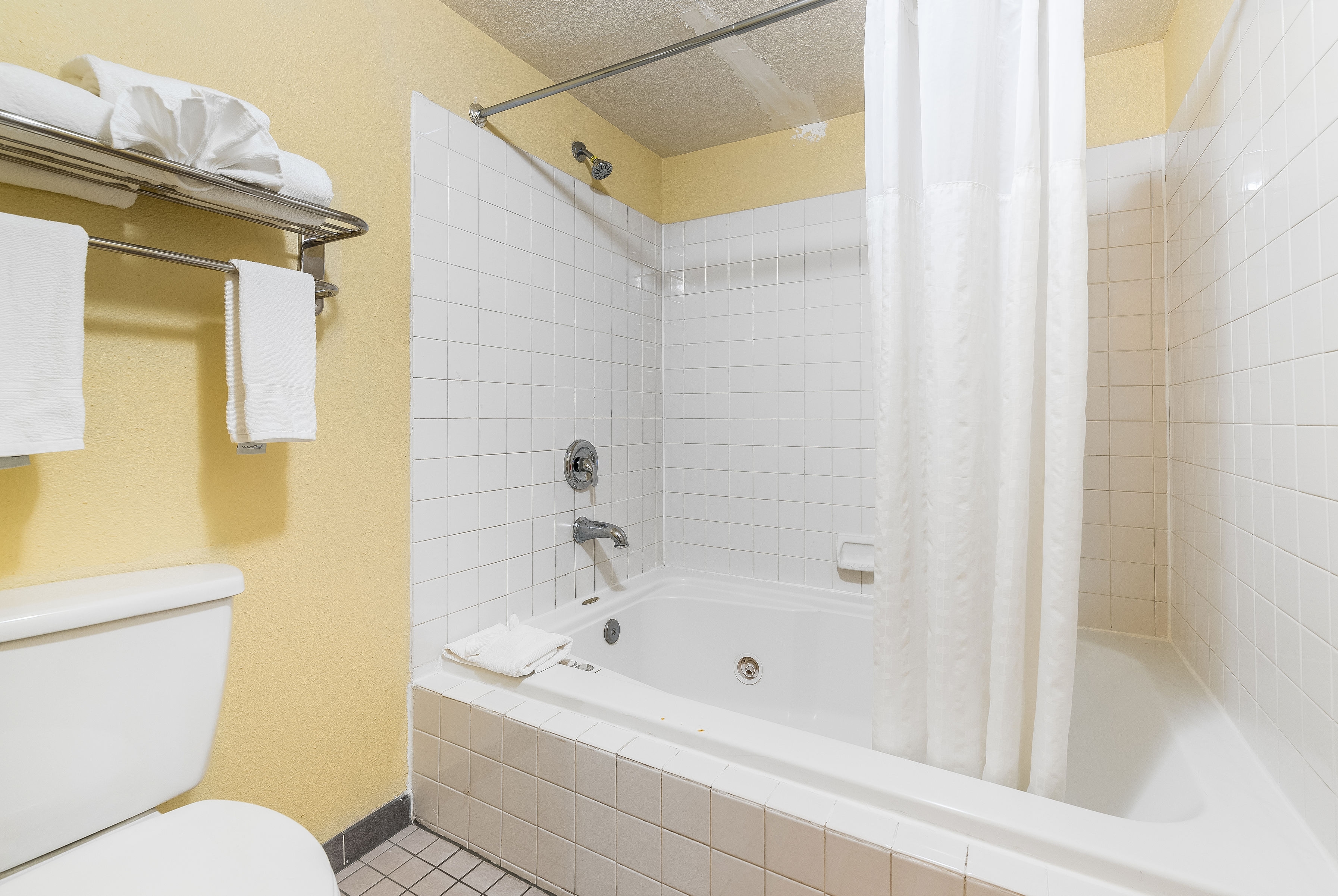 Guest room bath at the Days Inn by Wyndham Federal Way in Federal Way, Washington