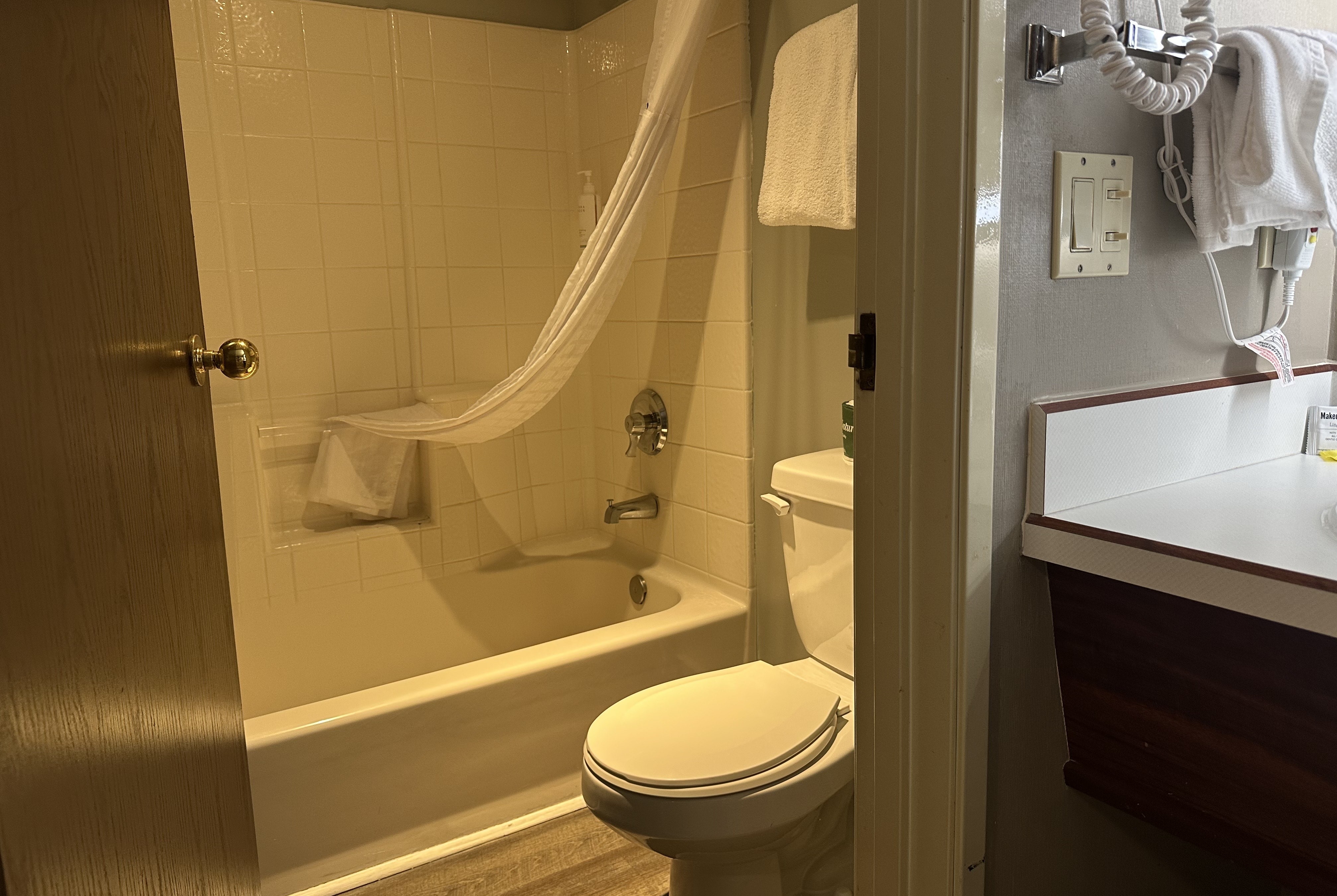 Guest room bath at the Days Inn by Wyndham Seatac Airport in Seattle, Washington