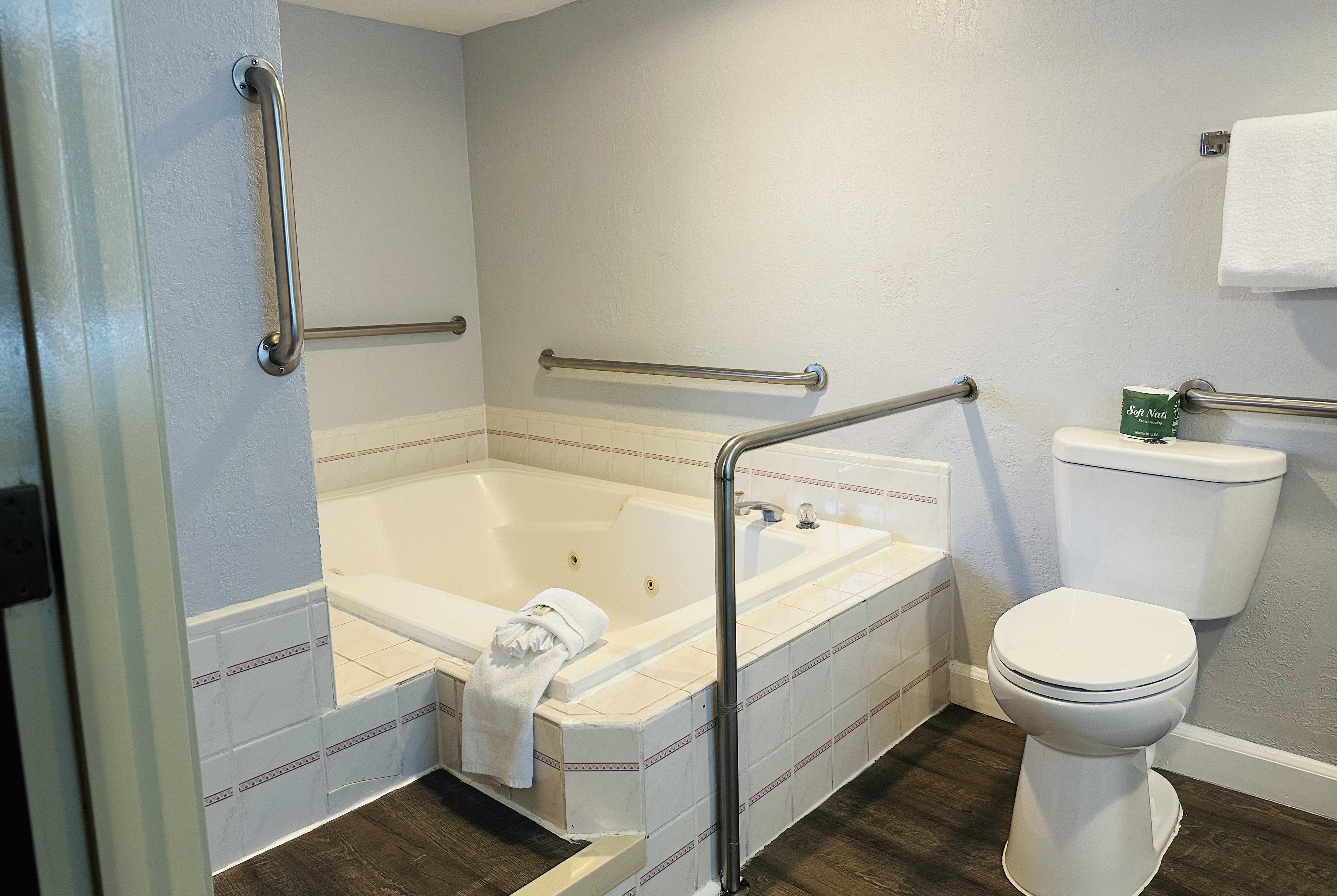 Guest room bath at the Days Inn by Wyndham Seatac Airport in Seattle, Washington