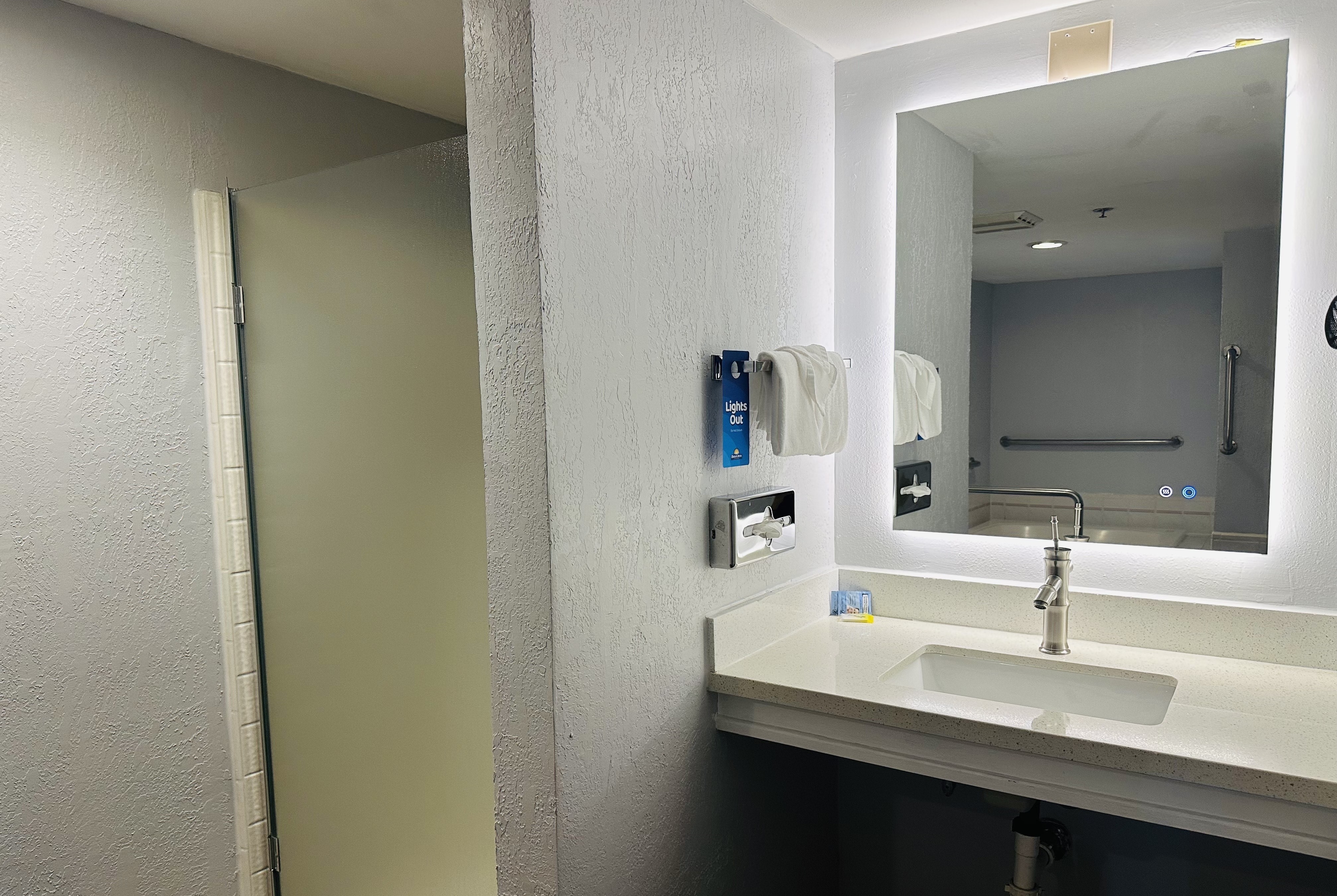 Guest room bath at the Days Inn by Wyndham Seatac Airport in Seattle, Washington