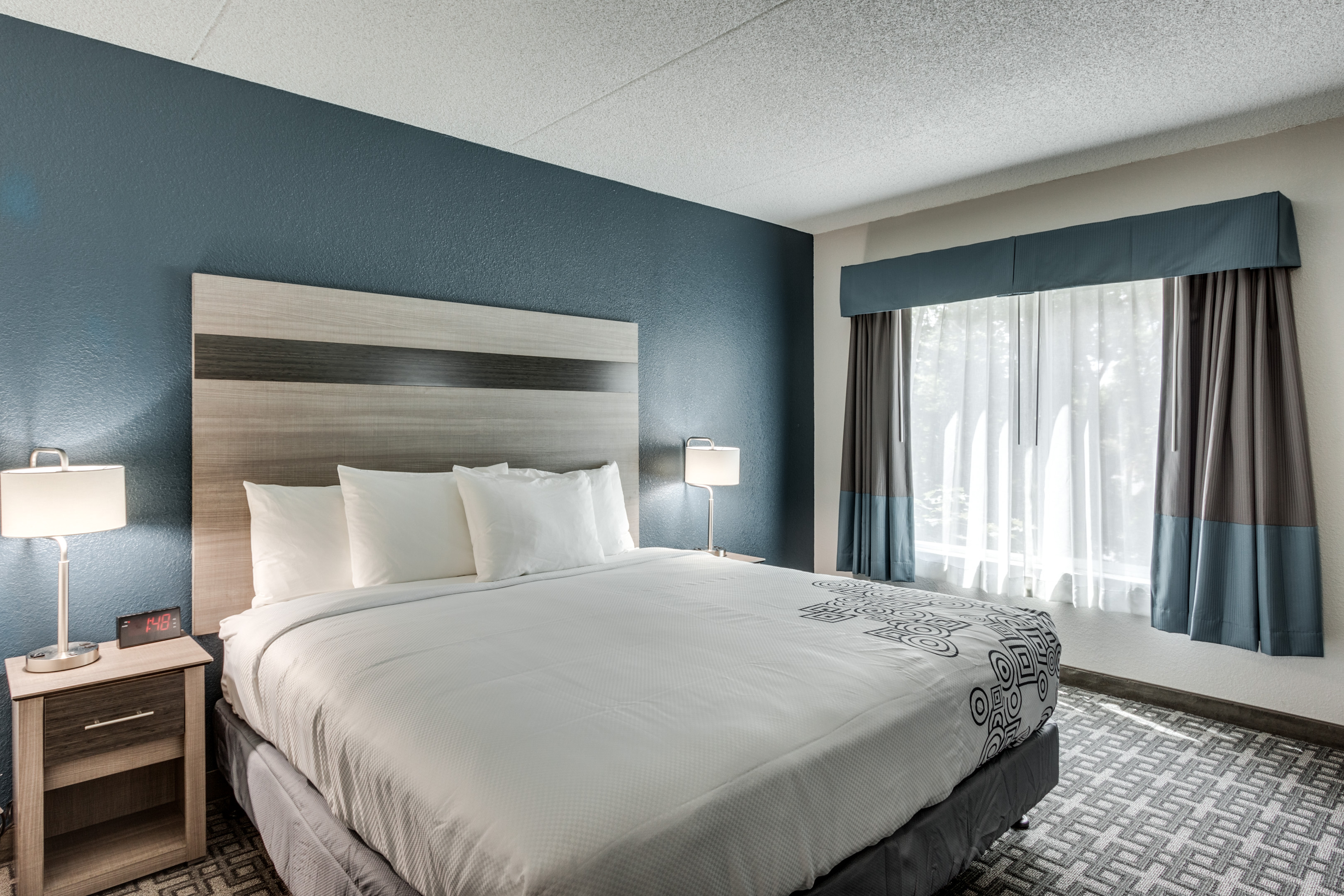 Guest room at the Days Inn & Suites by Wyndham Spokane in Spokane, Washington