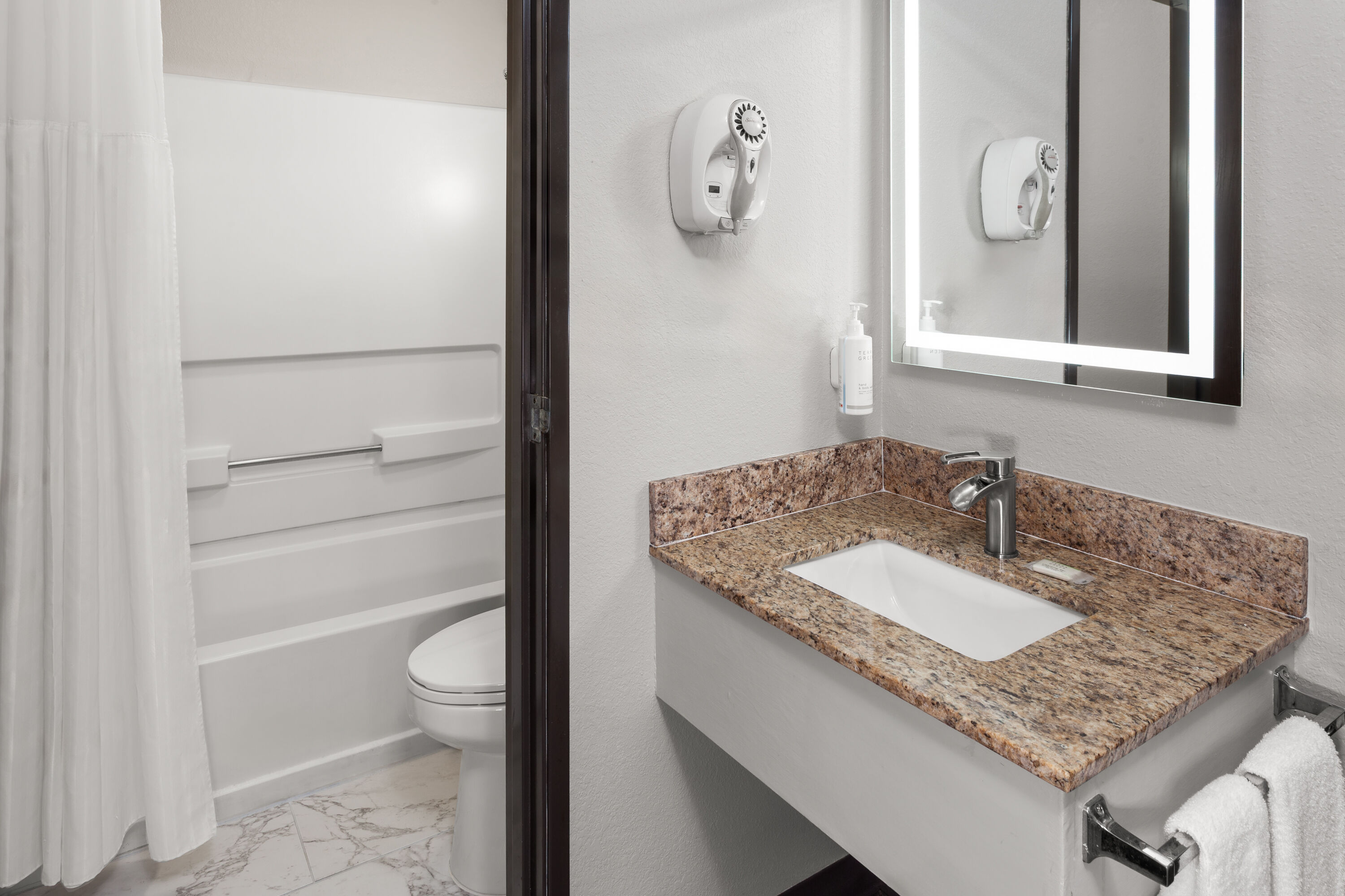 Guest room bath at the Days Inn & Suites by Wyndham Kaukauna WI in Kaukauna, Wisconsin