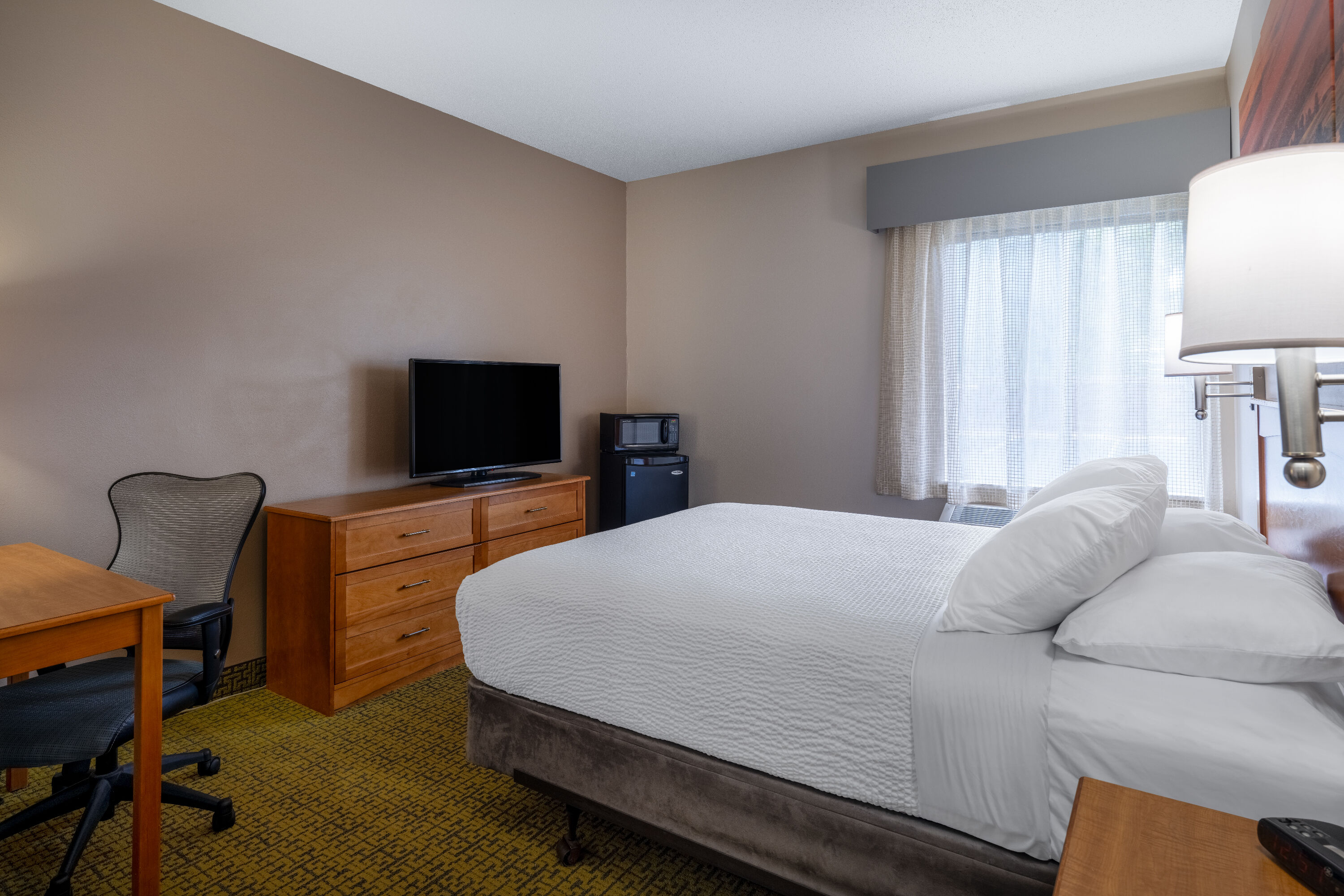 Guest room at the Days Inn & Suites by Wyndham Madison in Madison, Wisconsin