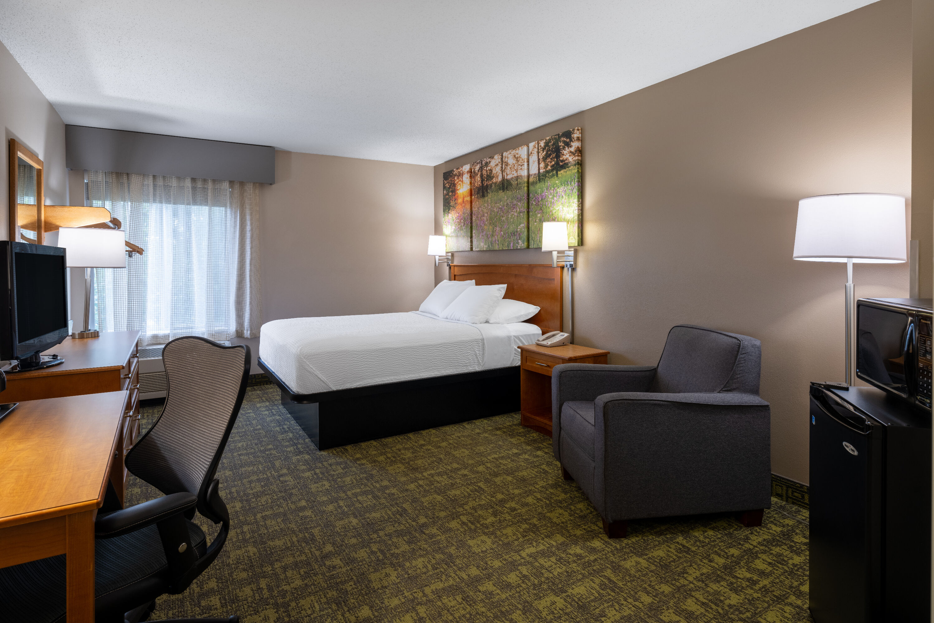 Guest room at the Days Inn & Suites by Wyndham Madison in Madison, Wisconsin