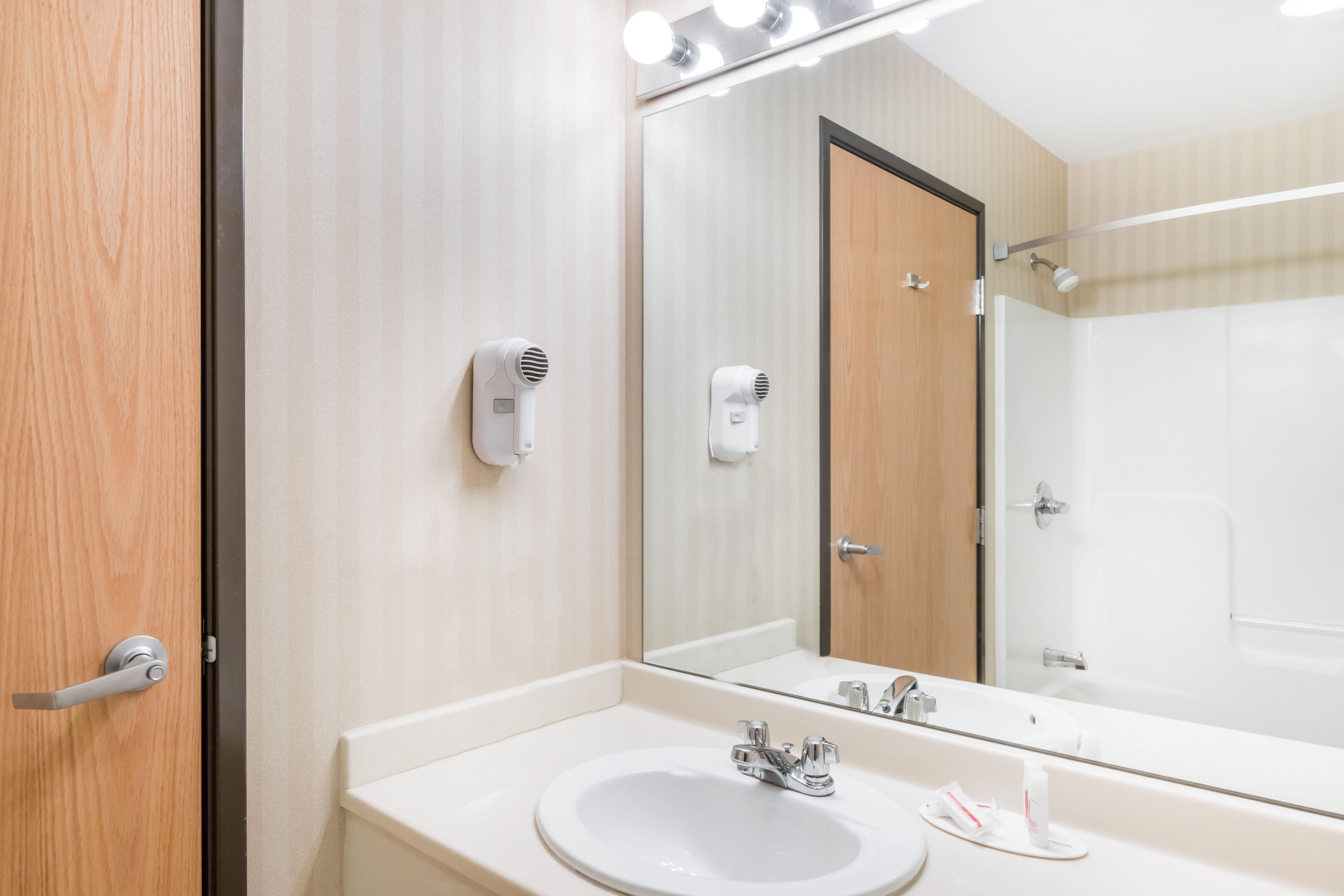 Guest room bath at the Days Inn & Suites by Wyndham Bridgeport - Clarksburg in Bridgeport, West Virginia