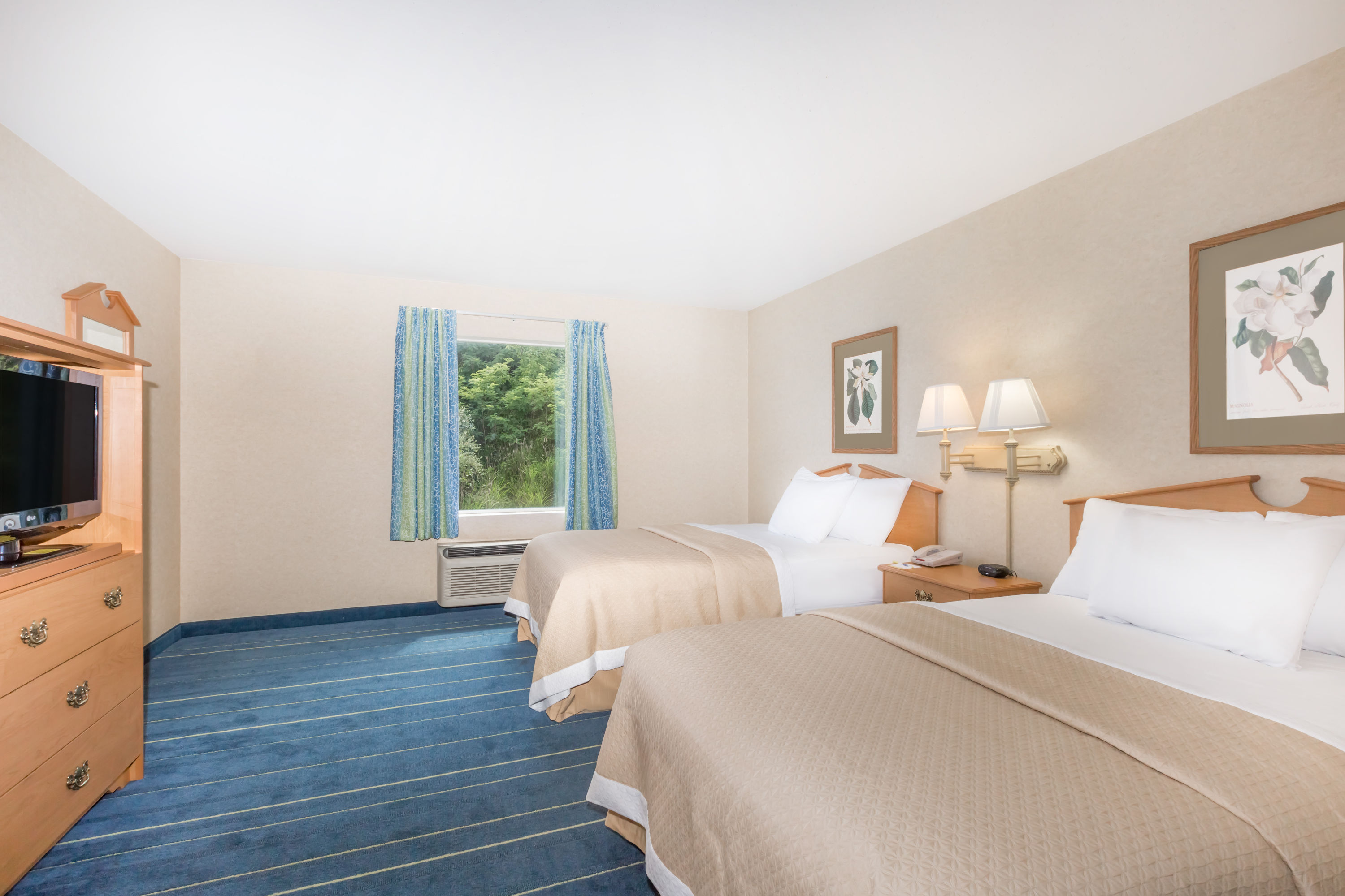 Guest room at the Days Inn & Suites by Wyndham Bridgeport - Clarksburg in Bridgeport, West Virginia