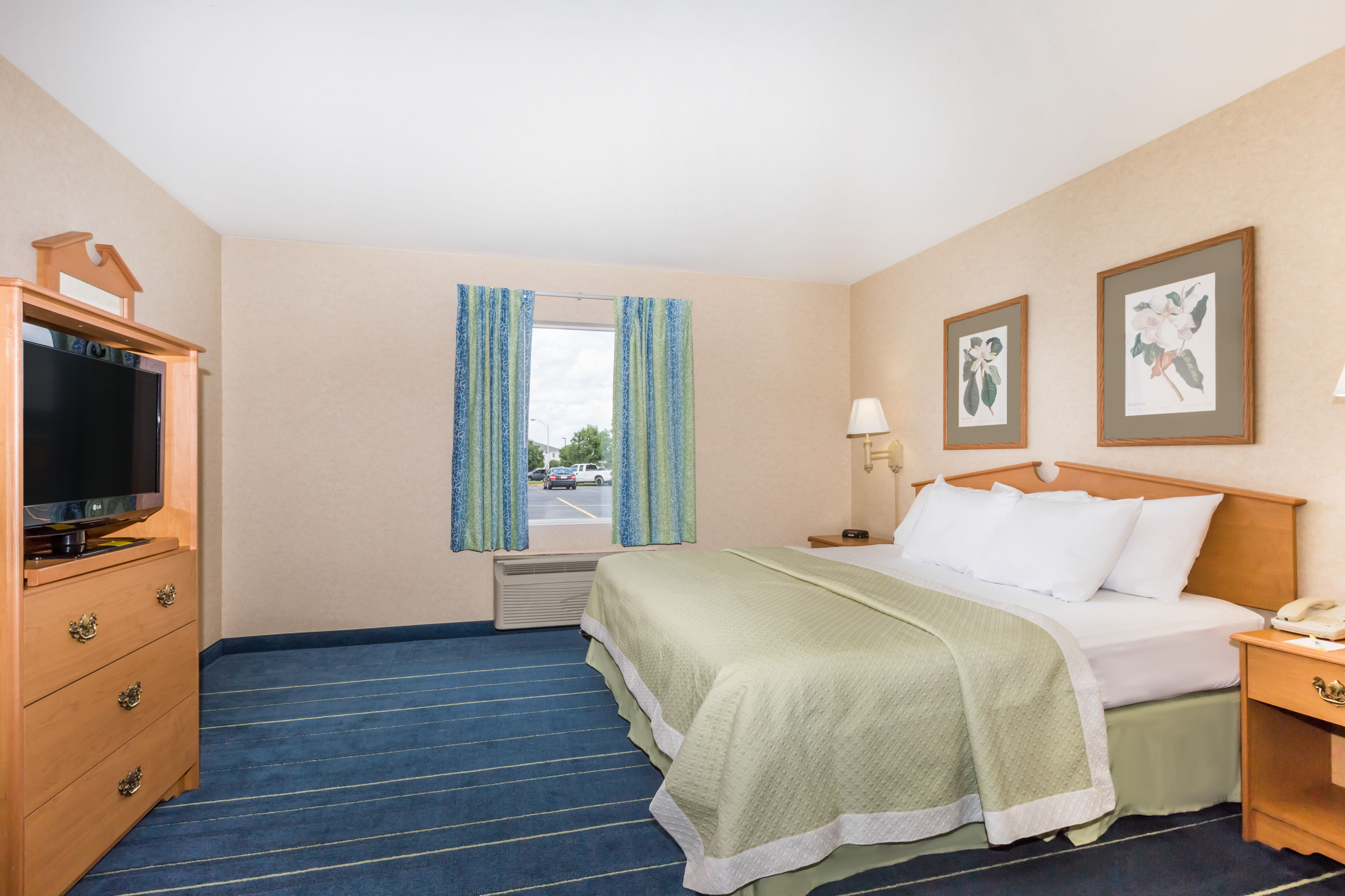 Guest room at the Days Inn & Suites by Wyndham Bridgeport - Clarksburg in Bridgeport, West Virginia