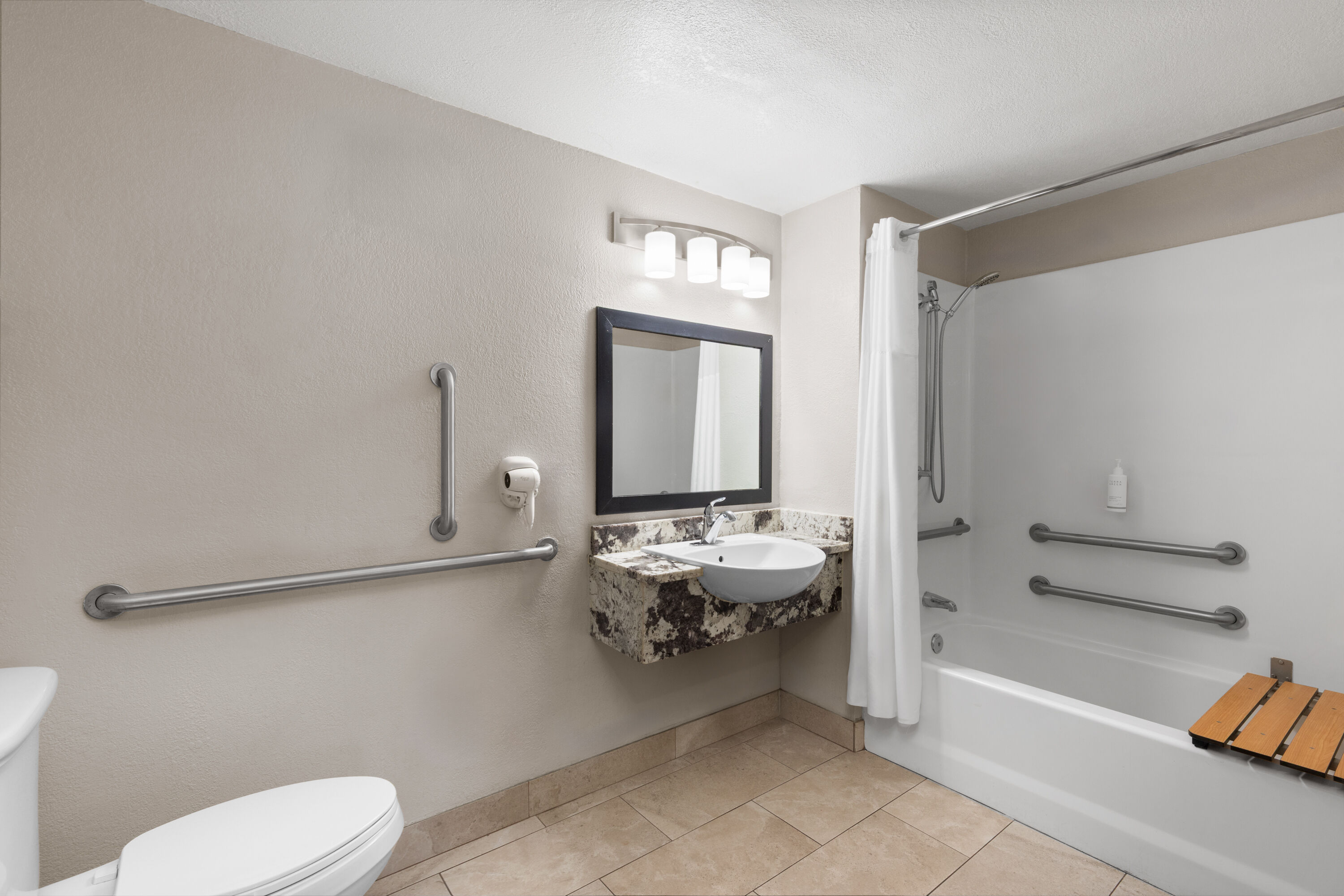 Guest room bath at the Days Inn by Wyndham Charleston WV in Charleston, West Virginia