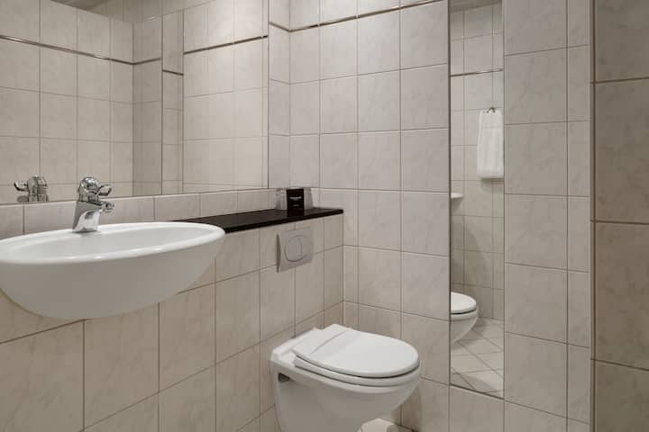 Guest room bath at the Comwell Hvide Hus Aalborg, Dolce by Wyndham in Aalborg, Other than US/Canada