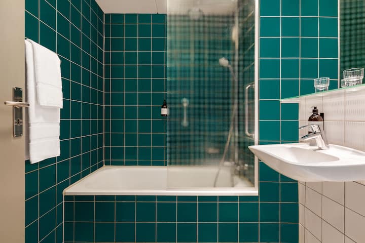 Guest room bath at the Comwell H. C. Andersen Odense Dolce by Wyndham in Odense C, Other than US/Canada
