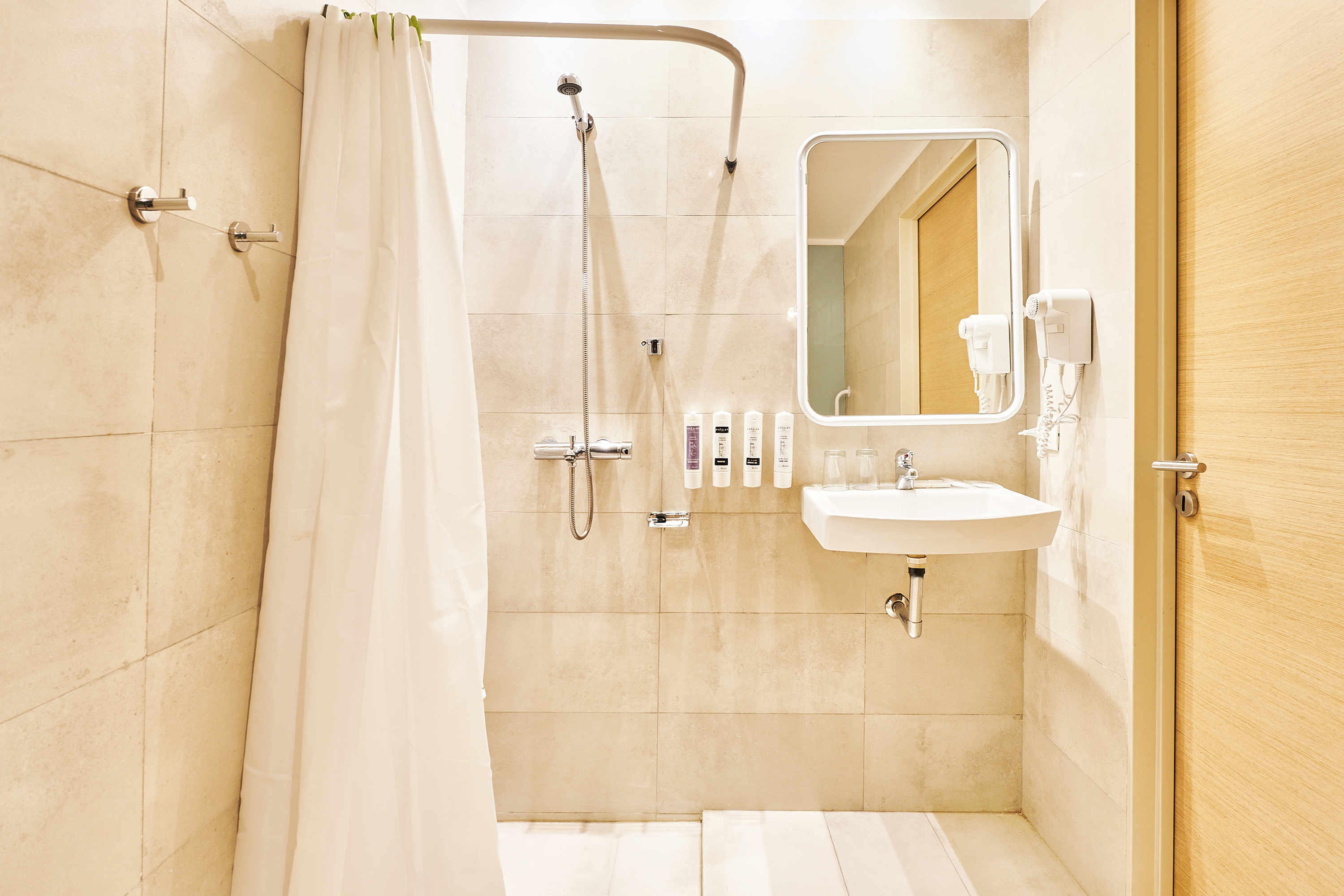 Guest room bath at the Dazzler by Wyndham Rosario in Rosario, Other than US/Canada