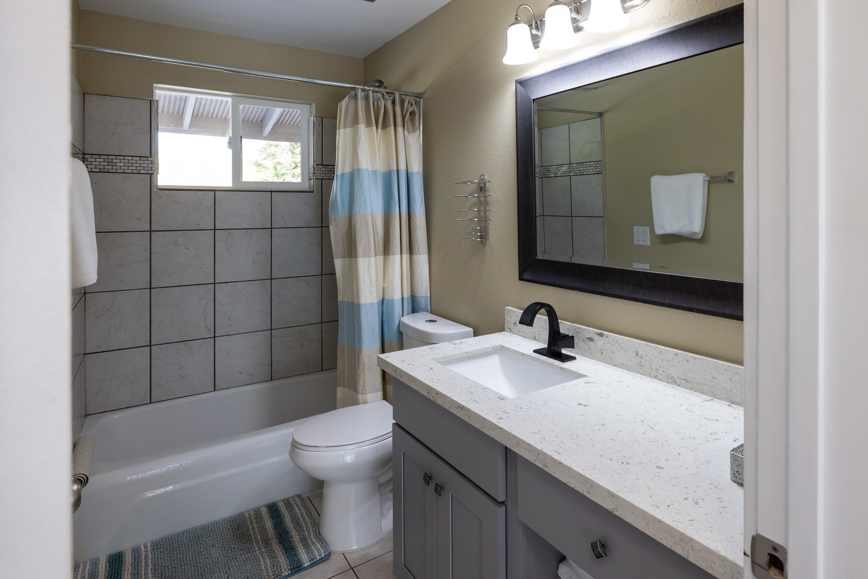 Guest room bath at the Interurban Suites Hotel, a Dazzler Select by Wyndham in Tukwila, Washington
