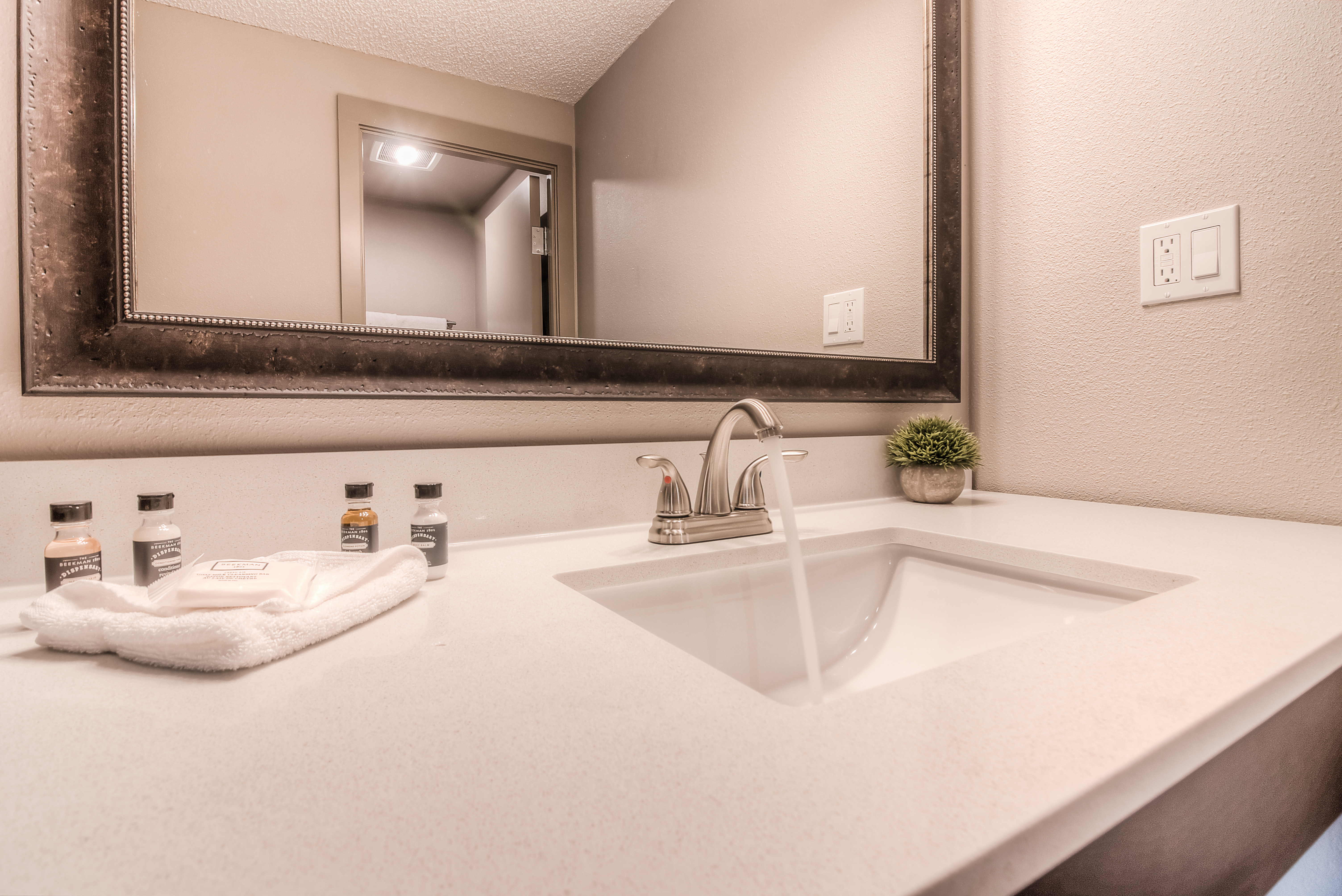 Guest room bath at the The Hotel Y, a Dazzler Select by Wyndham in Yakima, Washington