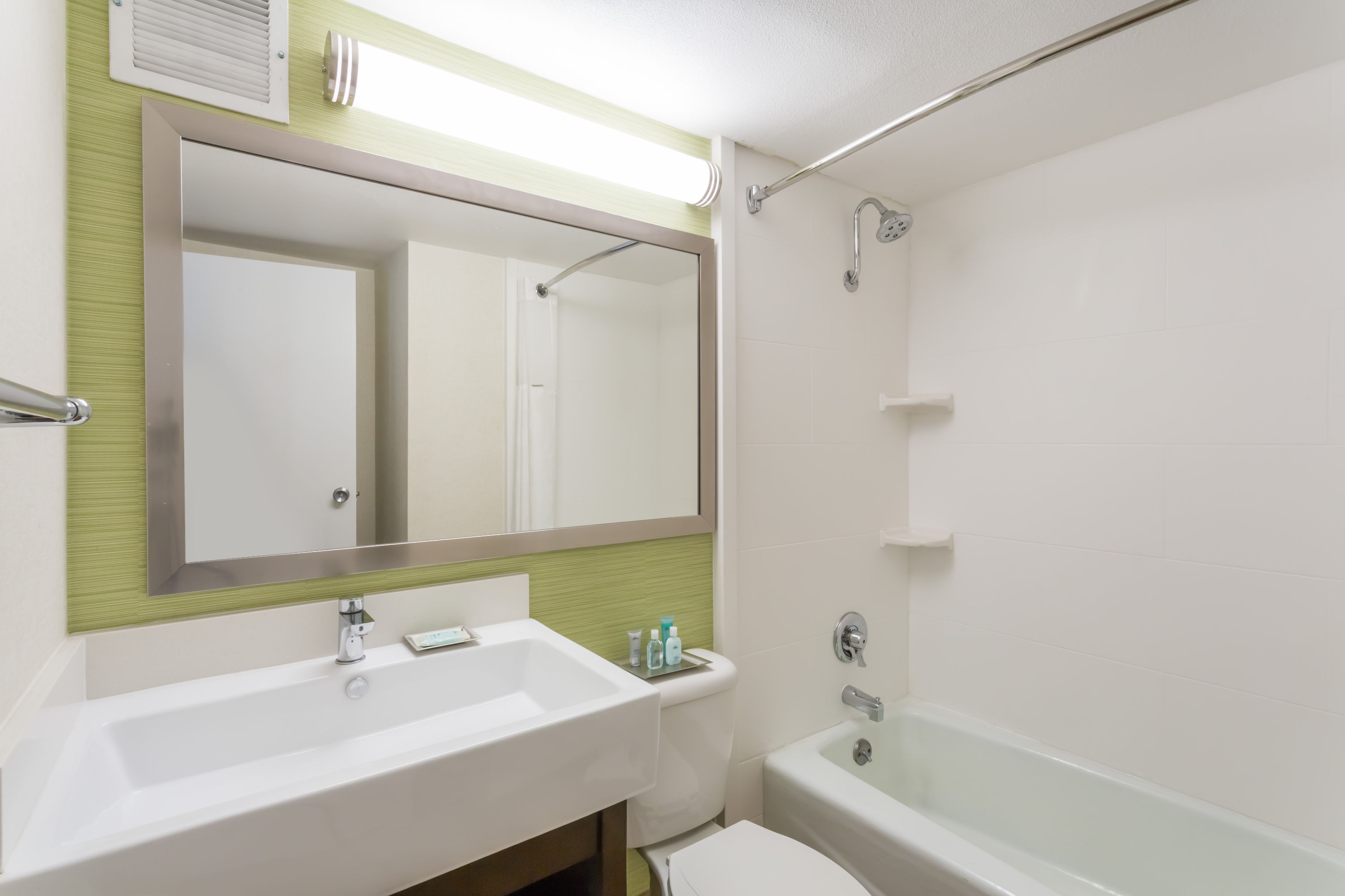 Guest room bath at the Wyndham Garden Fresno Yosemite Airport in Fresno, California