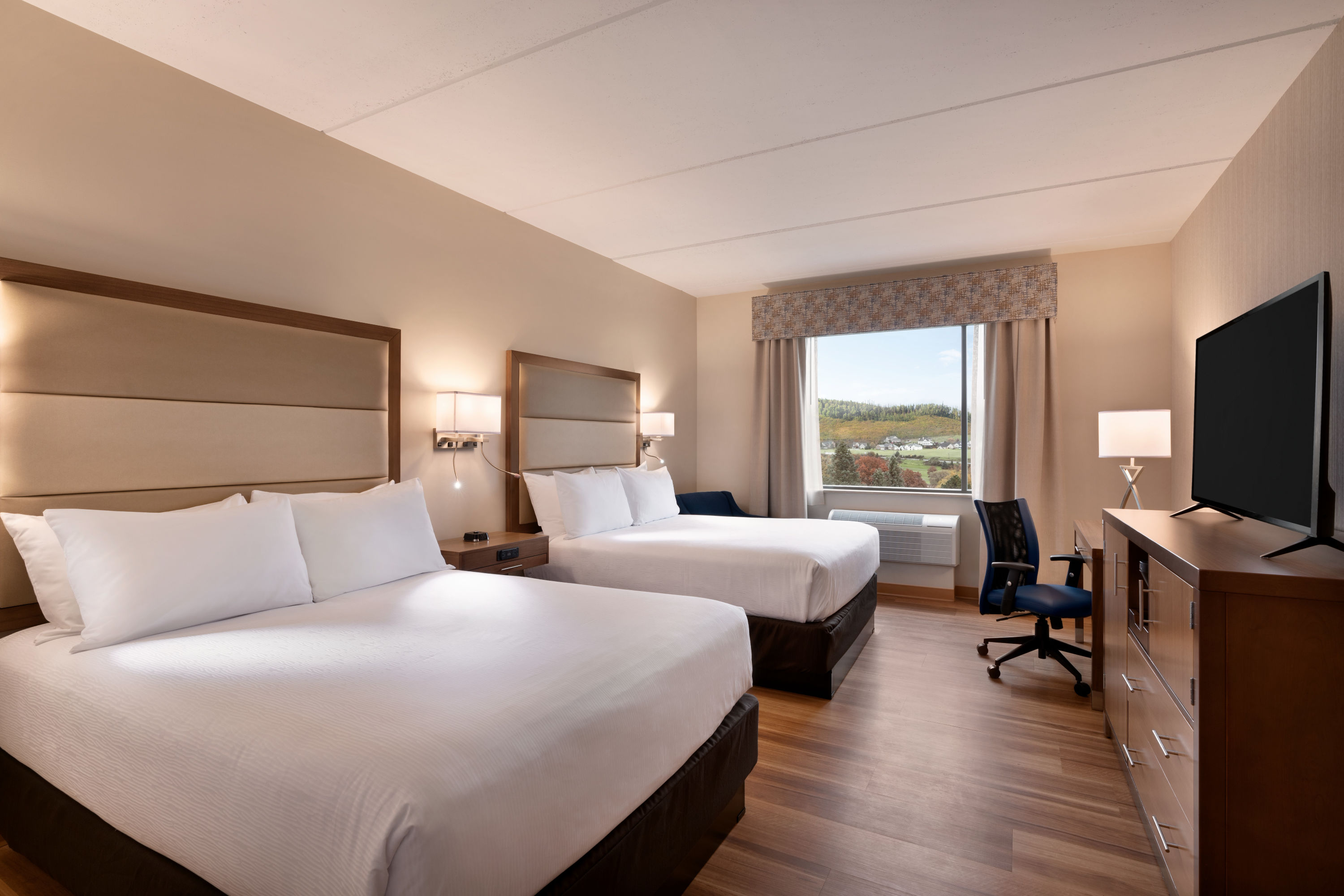 Queen bed guest room at the Wyndham Garden State College in Boalsburg, Pennsylvania