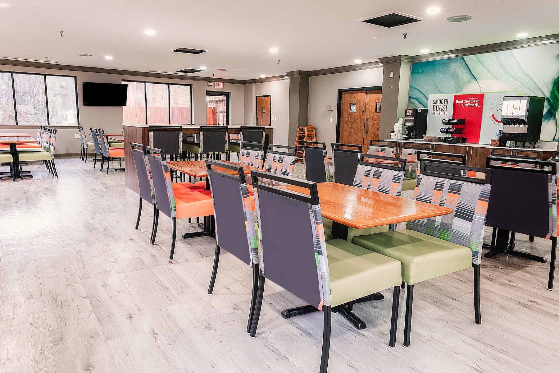 Wyndham Garden Williamsburg Busch Gardens Area restaurant breakfast area with seating in Williamsburg, Virginia