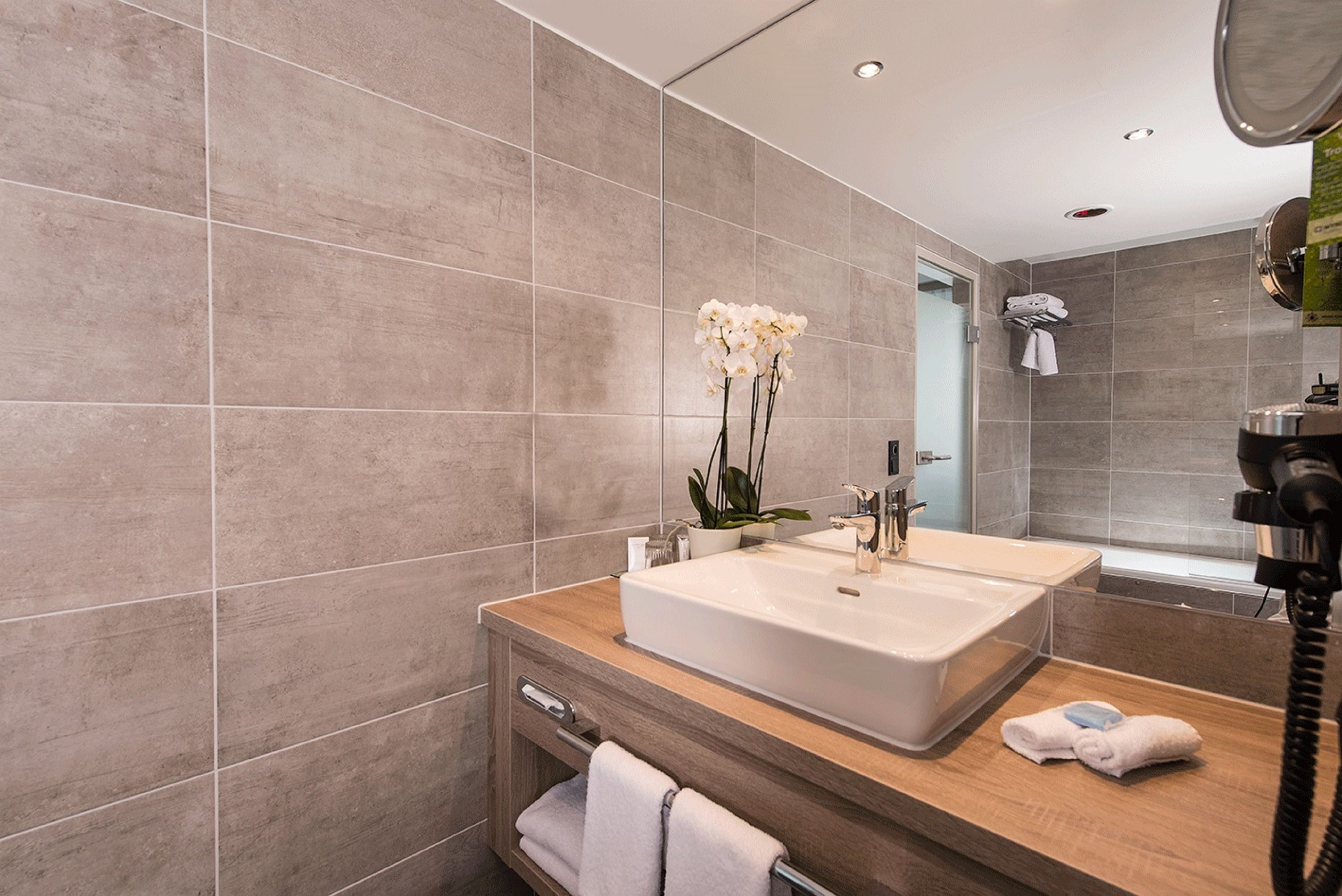 Guest room bath at the Wyndham Grand Salzburg Conference Centre in Salzburg, Other than US/Canada