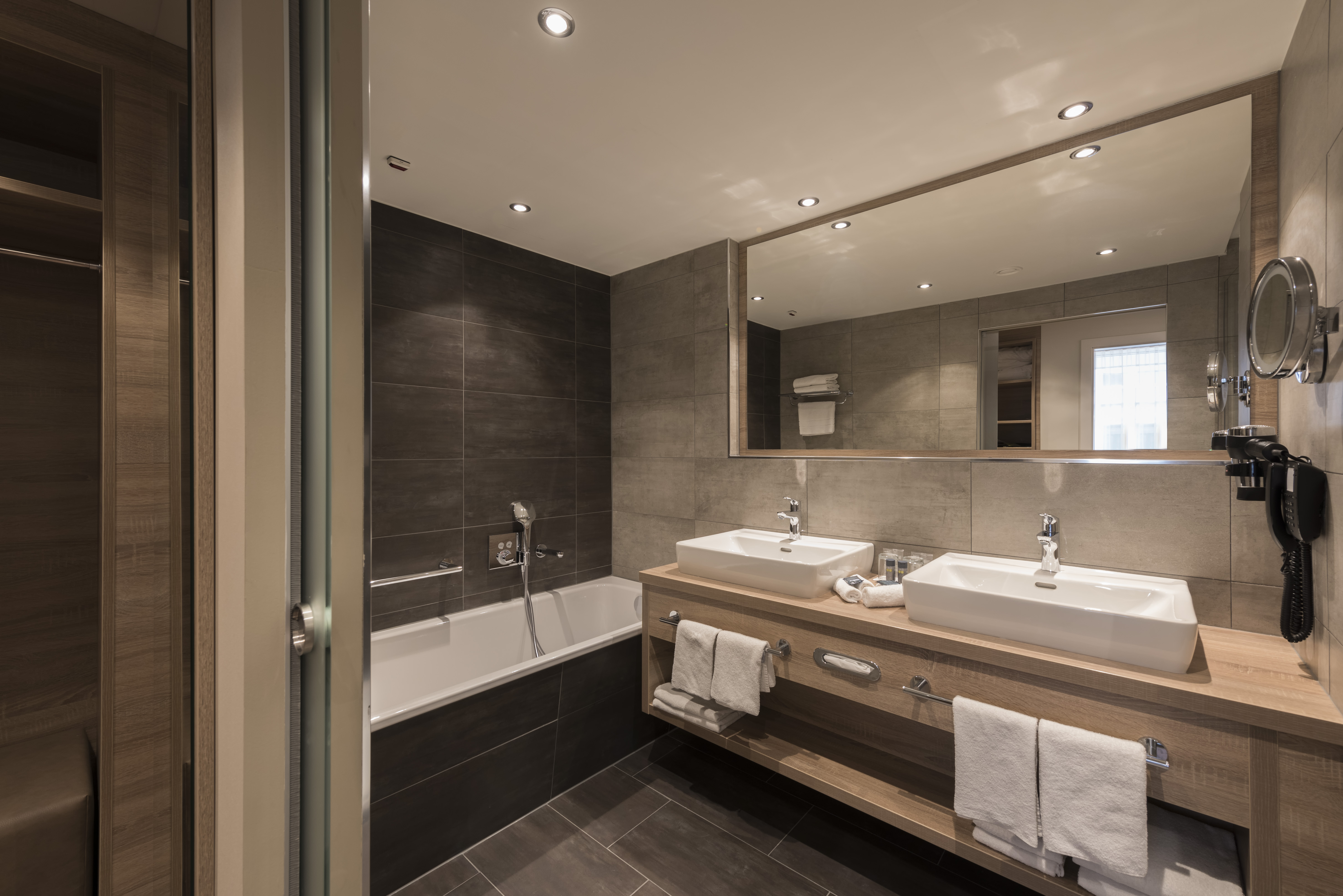 Guest room bath at the Wyndham Grand Salzburg Conference Centre in Salzburg, Other than US/Canada